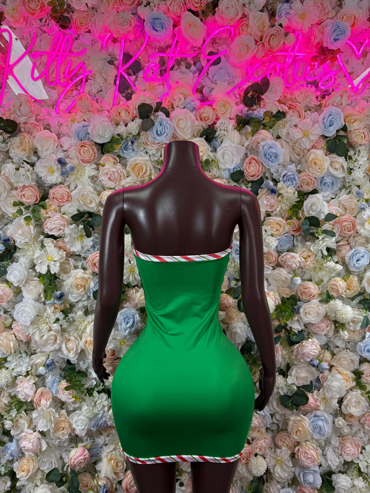 Green Santa-style mini leotard with candy-cane neckline and hem trim
