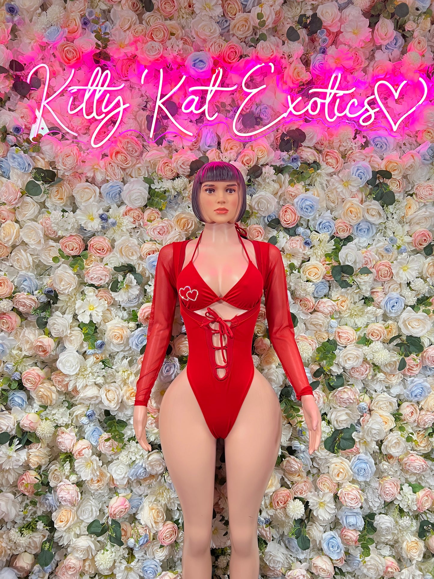 Red heart-print lace-up bodysuit with long sleeves and deep V front