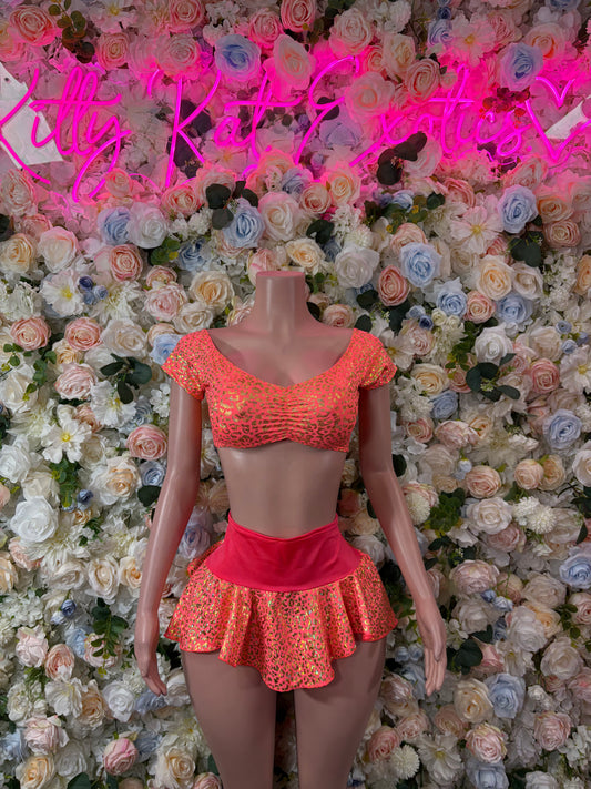 Coral cheetah-print two-piece dance set with off-shoulder top and ruffled mini skirt