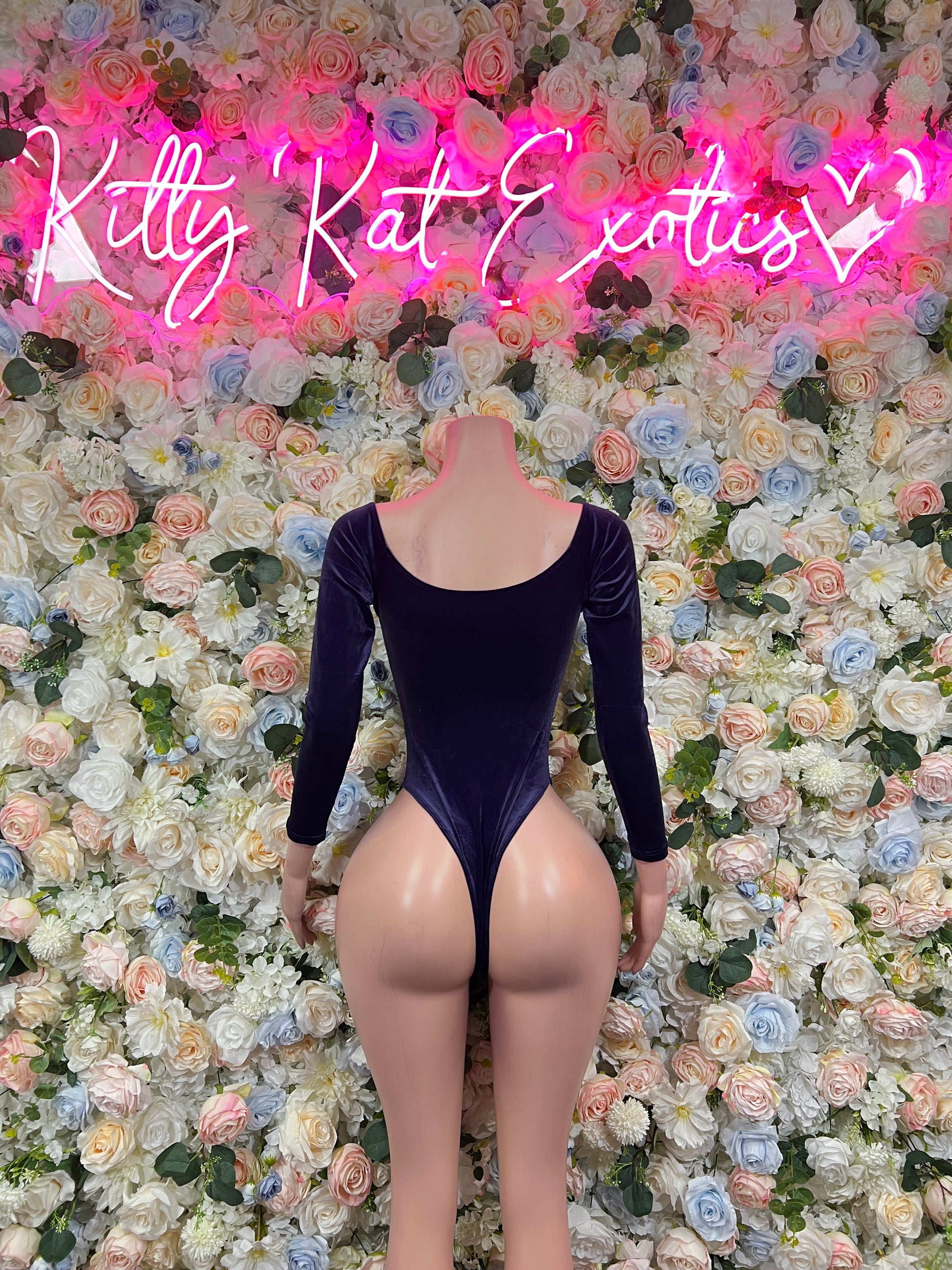 Dark blue velvet bodysuit with open back and long sleeves, high-cut leg
