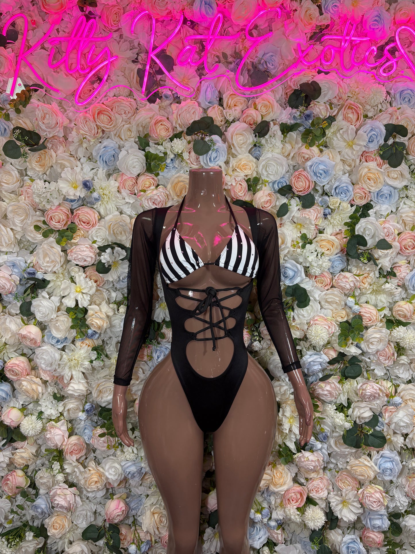 Black sheer referee-style bodysuit with striped panels and lace-up front