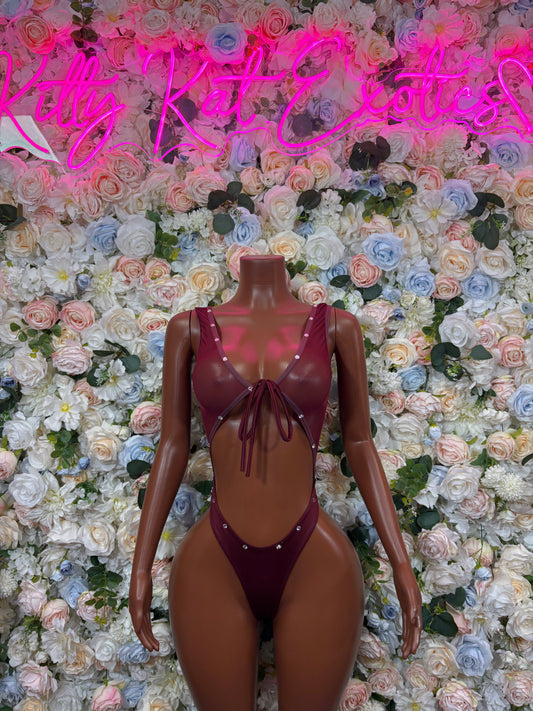 Burgundy lace-up bodysuit with thin straps and deep V neckline