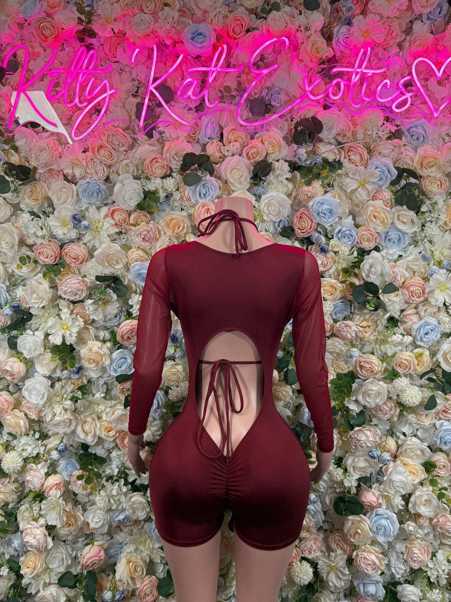 Burgundy long-sleeve one-piece bodysuit with crisscross back lace-up