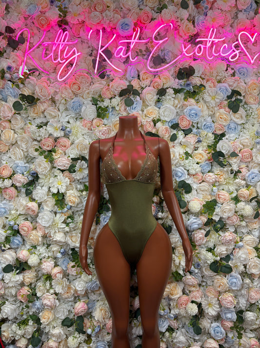 Green one-piece bodysuit with high-cut legs and thin straps, front view