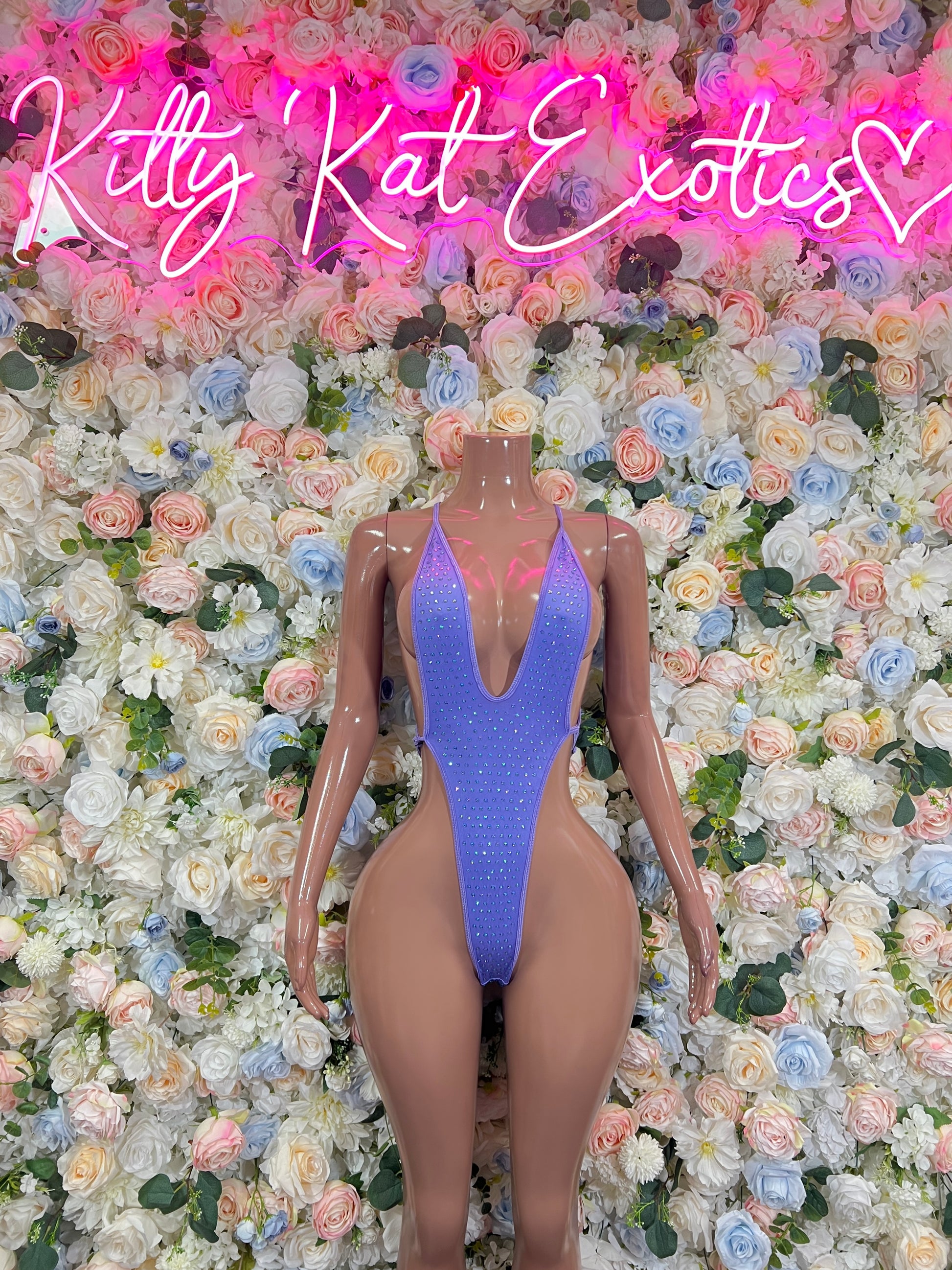 Lilac rhinestone bodysuit with deep V neckline and thong cut, adjustable straps