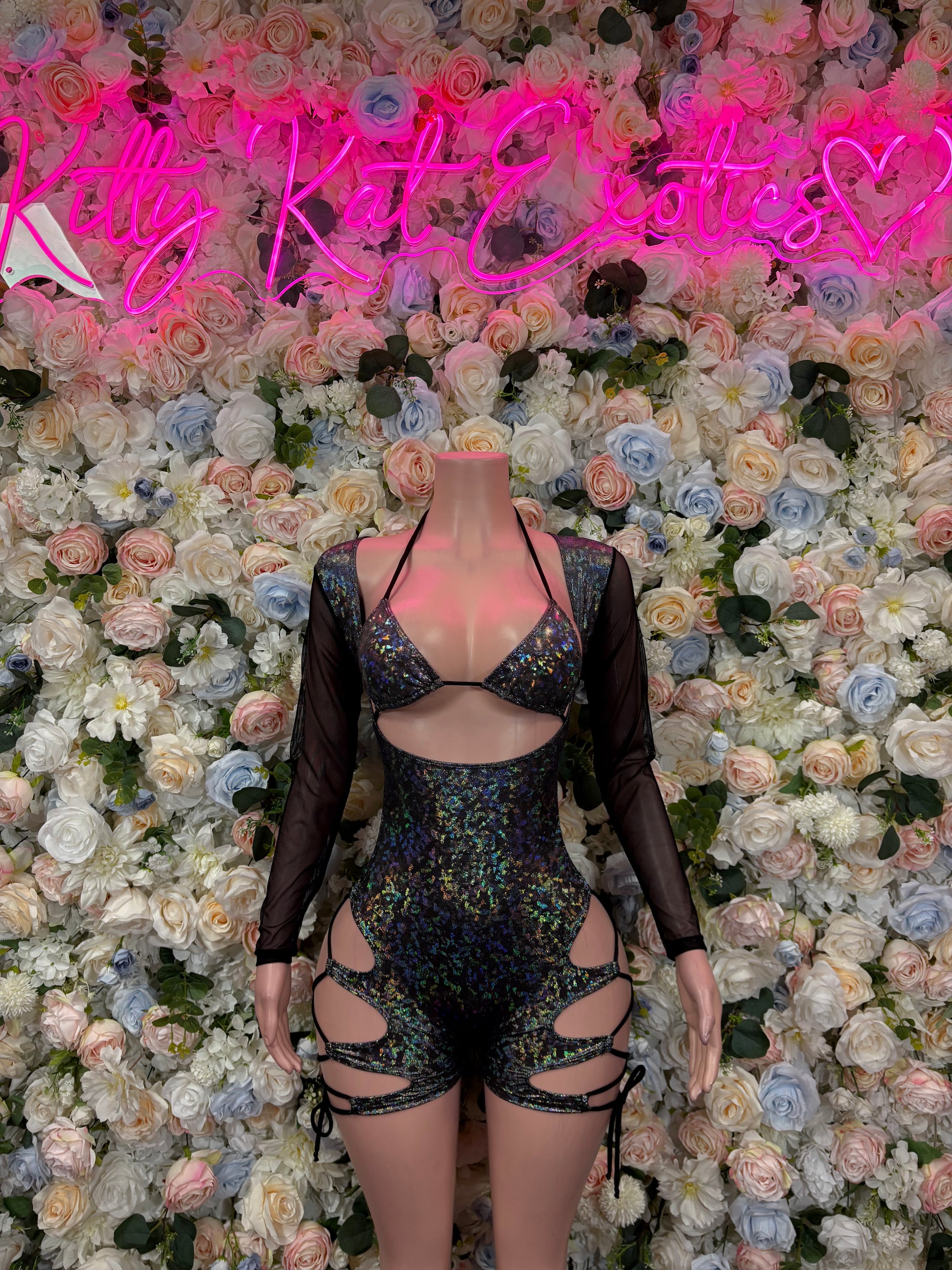 Black metallic bodysuit with sheer sleeves, high cut, and front strappy cutouts