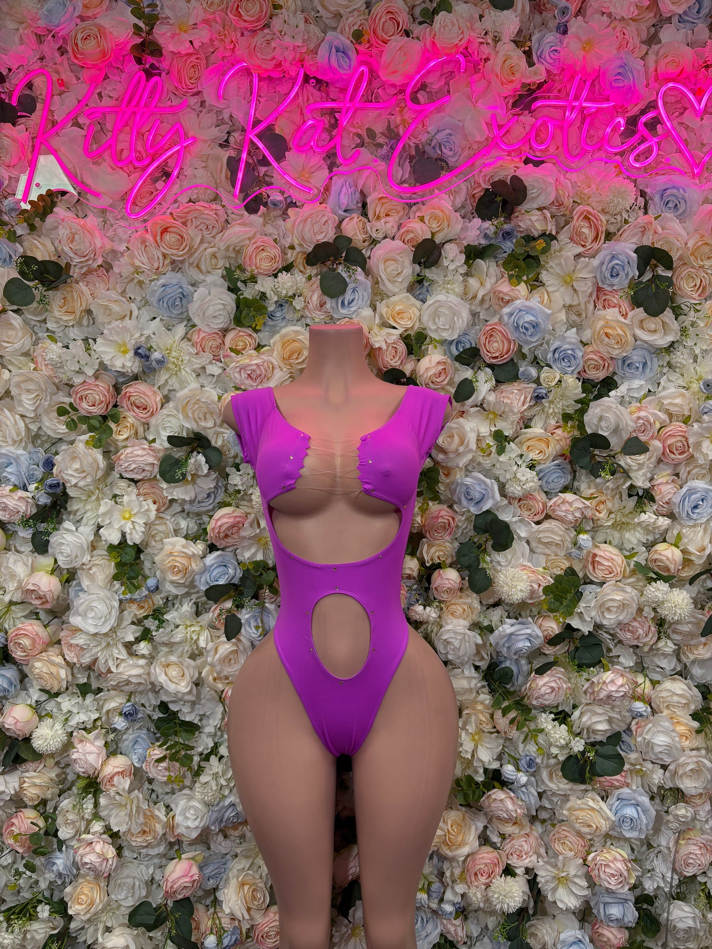 Purple one-piece rave bodysuit with scoop back and center back cutout