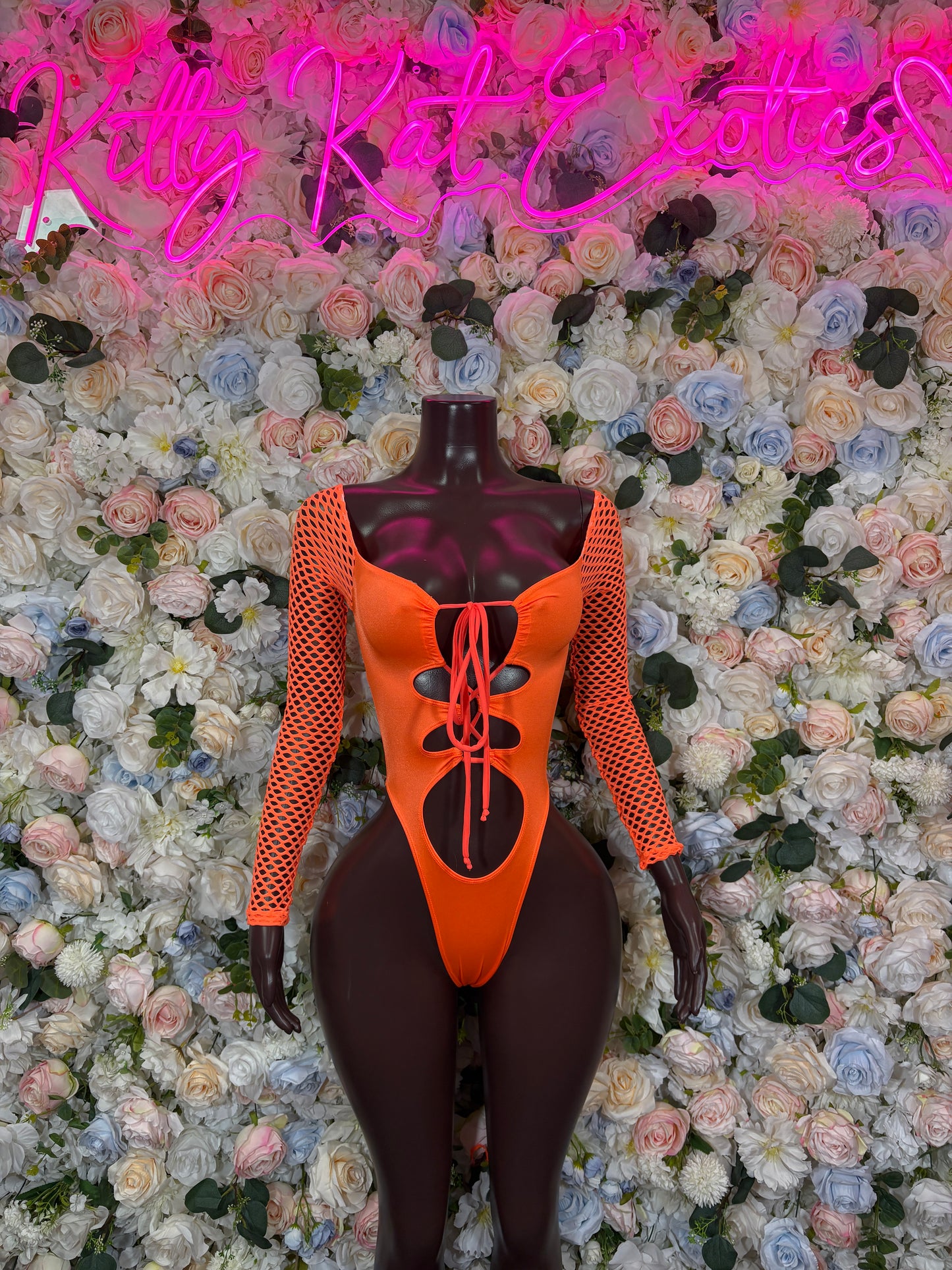Orange mesh long-sleeve bodysuit with corset-style center lacing and high-cut leg