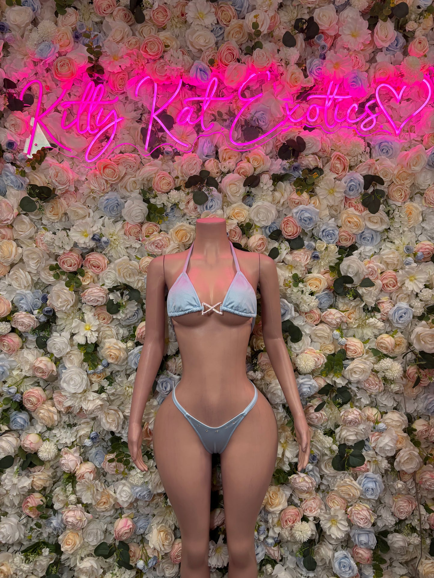 Light-blue triangle bikini with lace trim, tie-front top and string bikini bottoms