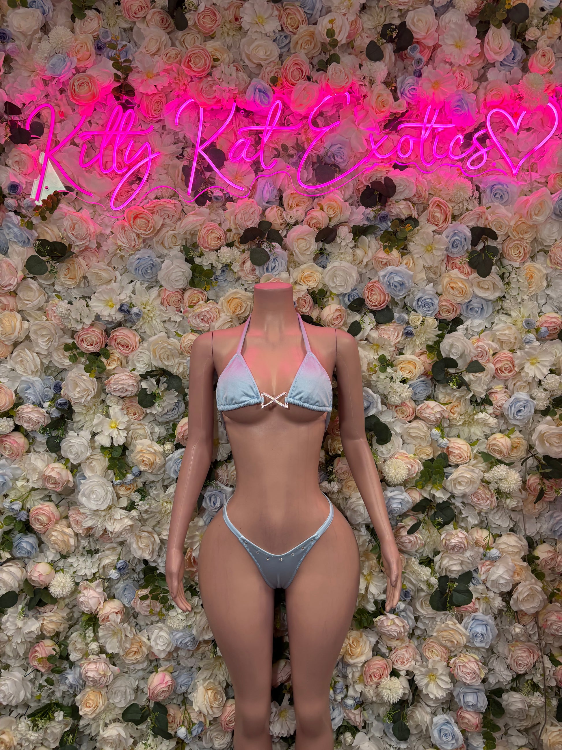 Light-blue triangle bikini with lace trim, tie-front top and string bikini bottoms