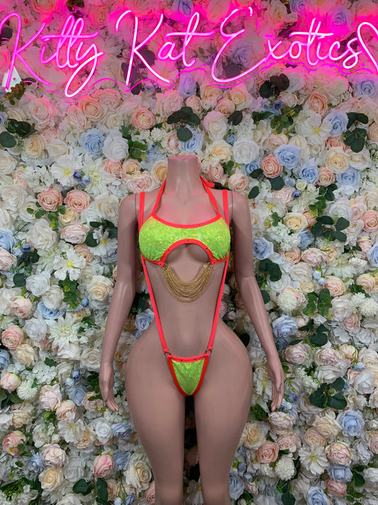 Neon bikini slingshot swimsuit with red trim, neon green cups, and gold chain detail