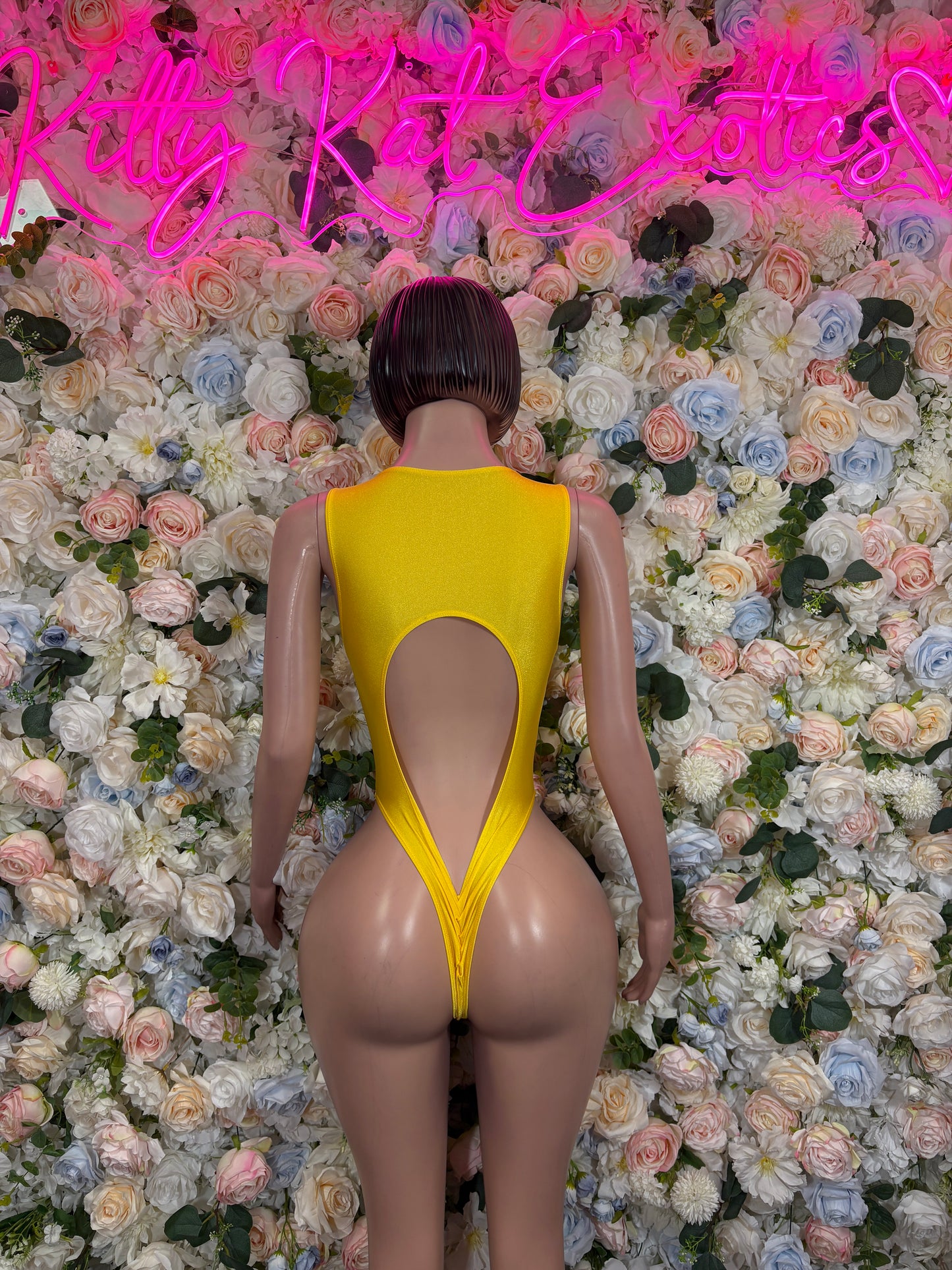 Yellow metallic open-back bodysuit with central cutout and thong-style bottom
