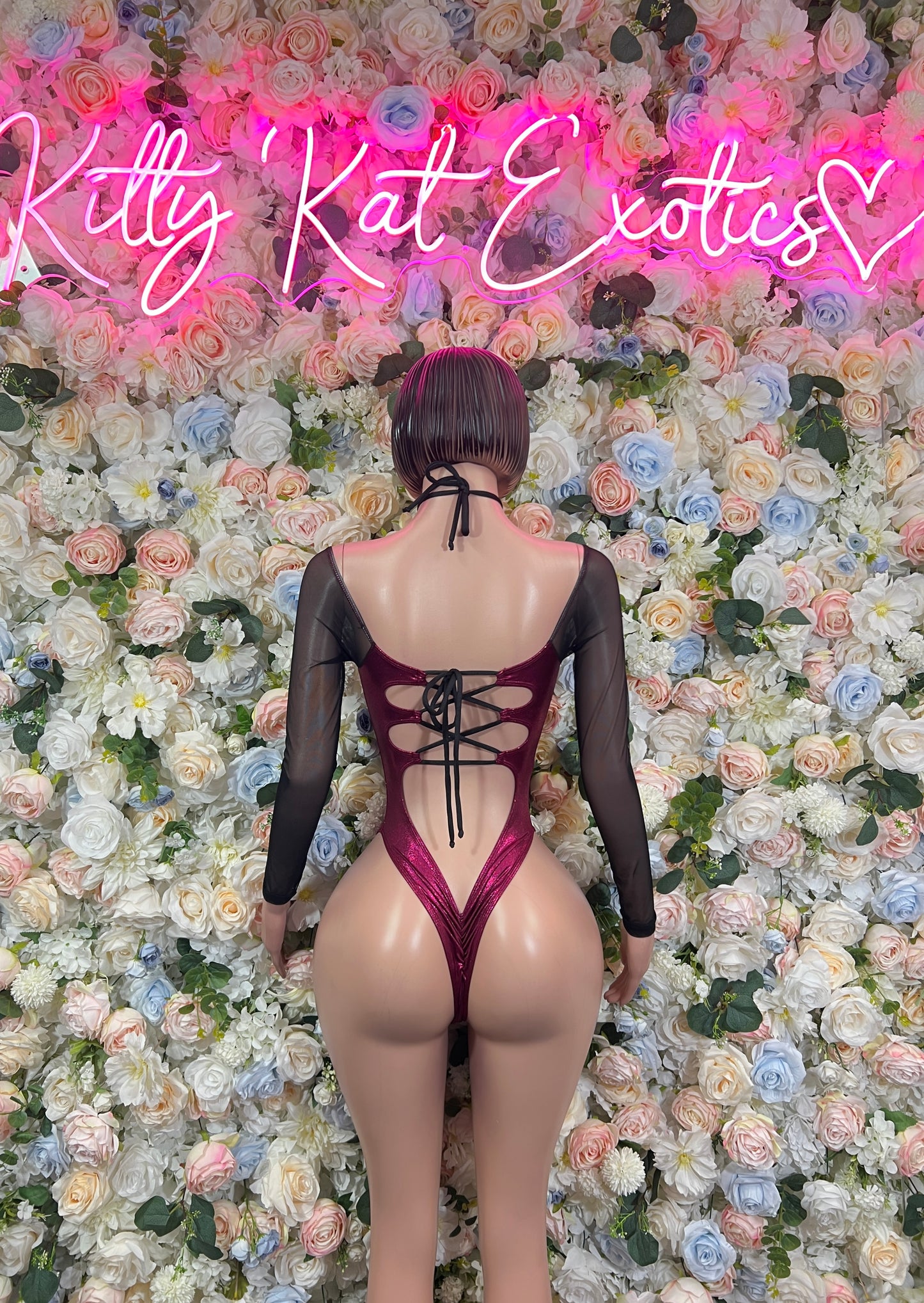 Burgundy dance bodysuit with open back lace-up detail and long sheer sleeves