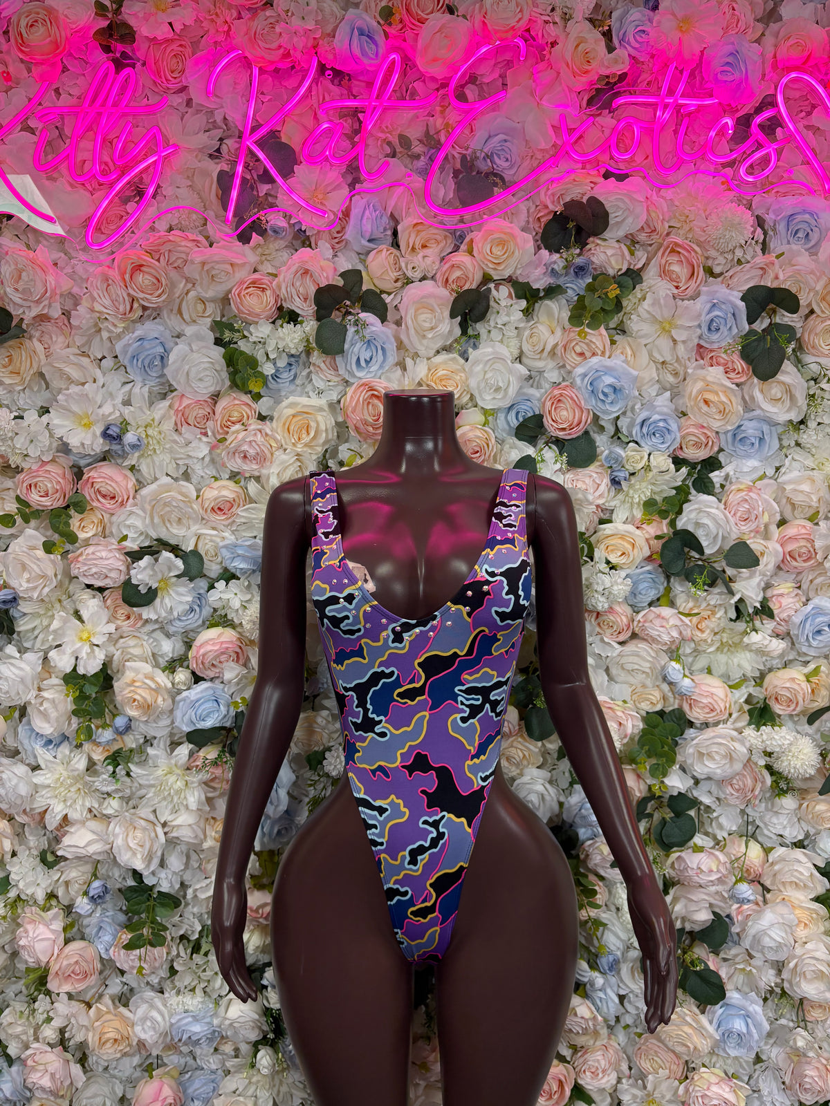 Purple camo print bodysuit with scoop neck and thin straps, front view on mannequin