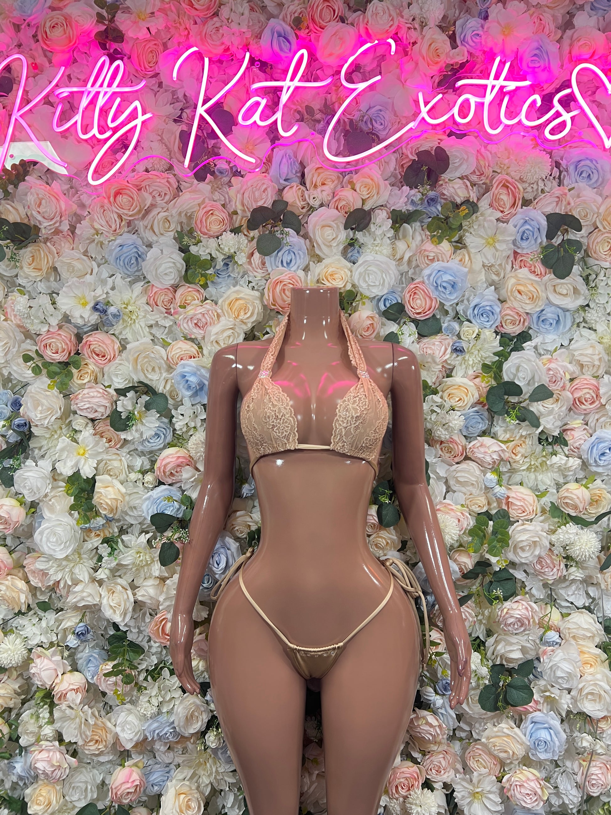 Beige two-piece bikini set with strappy top and tie-side thong bottoms