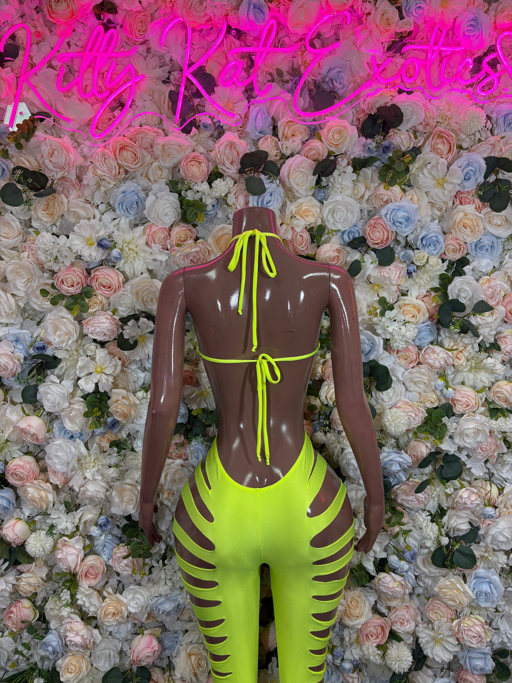 Neon yellow cut-out bodysuit with open back and lace-up ties, sleeveless