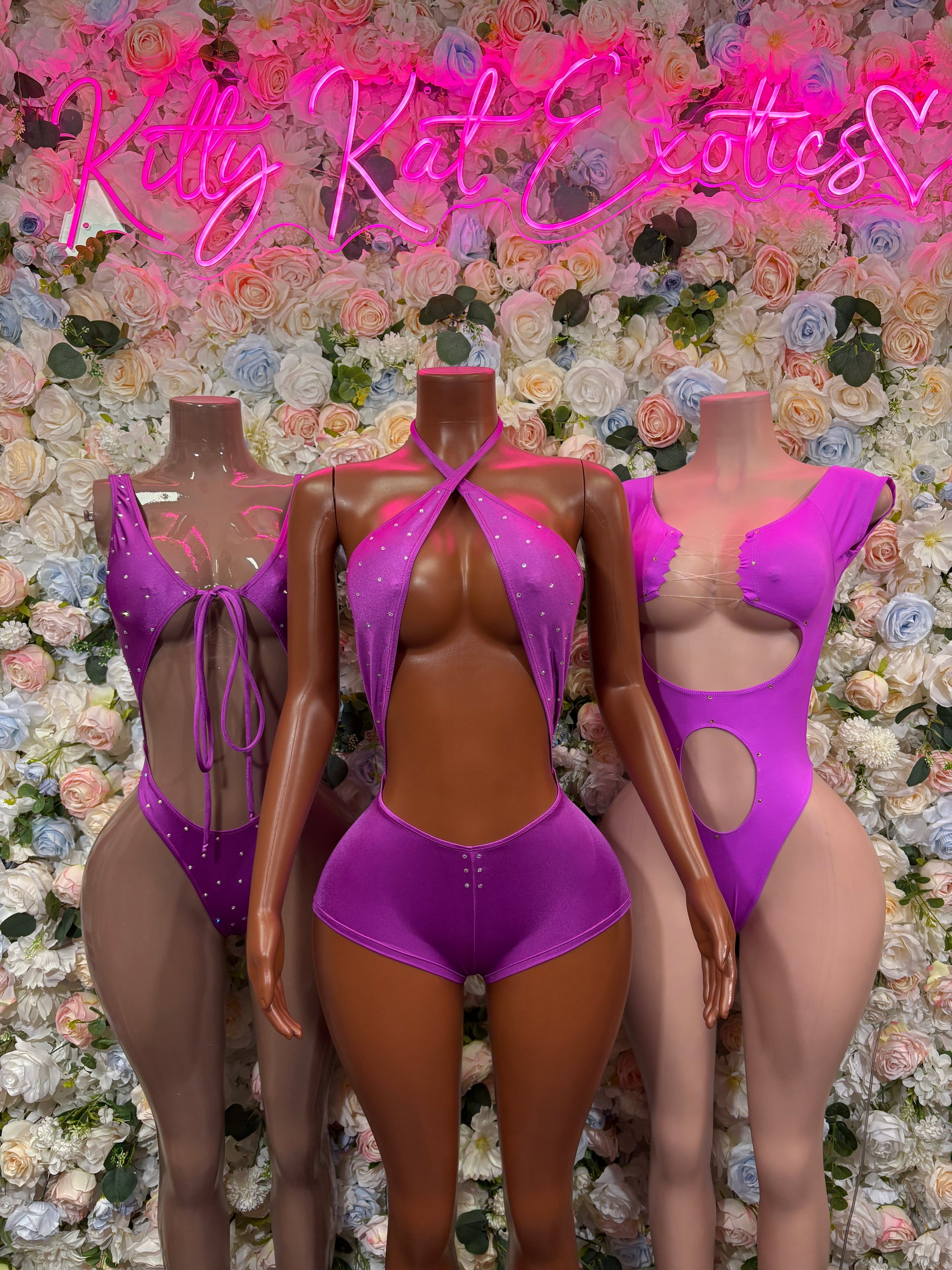 Purple backless one-piece rave bodysuit with halter straps and low-cut front