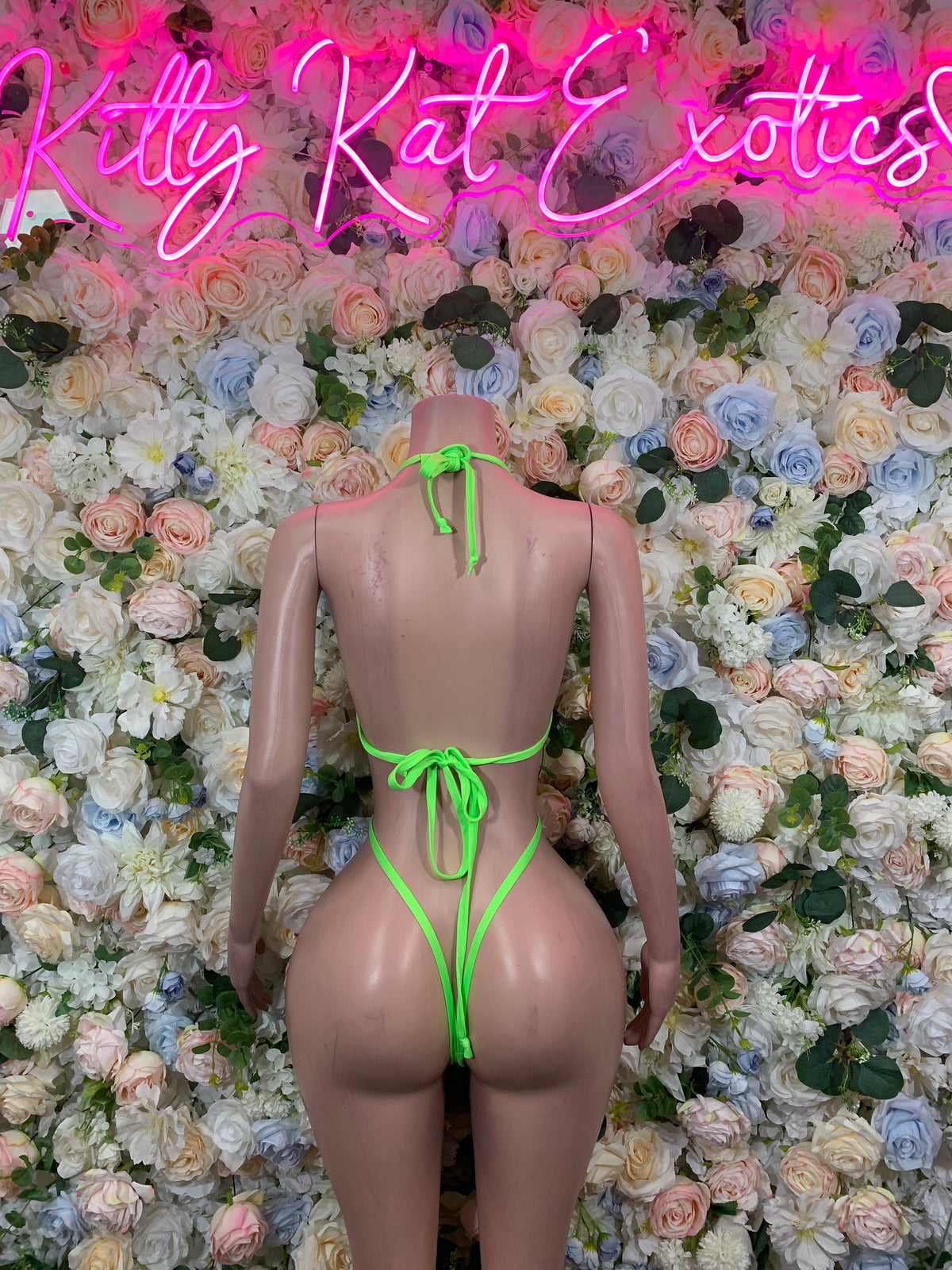 Neon green strappy bodysuit with cutout back and neck ties