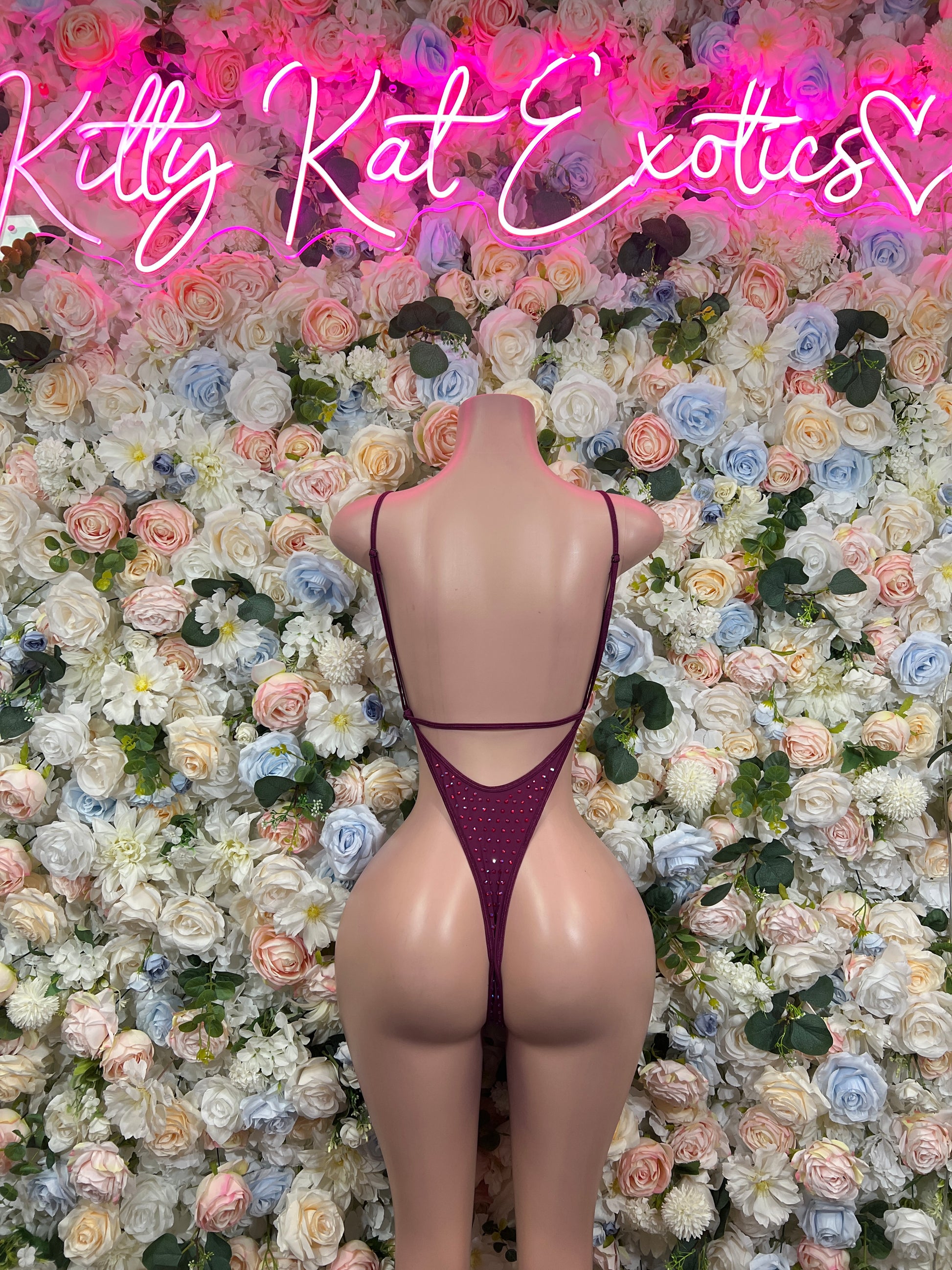 Maroon rhinestone bodysuit with open back and thin straps, high-cut one-piece