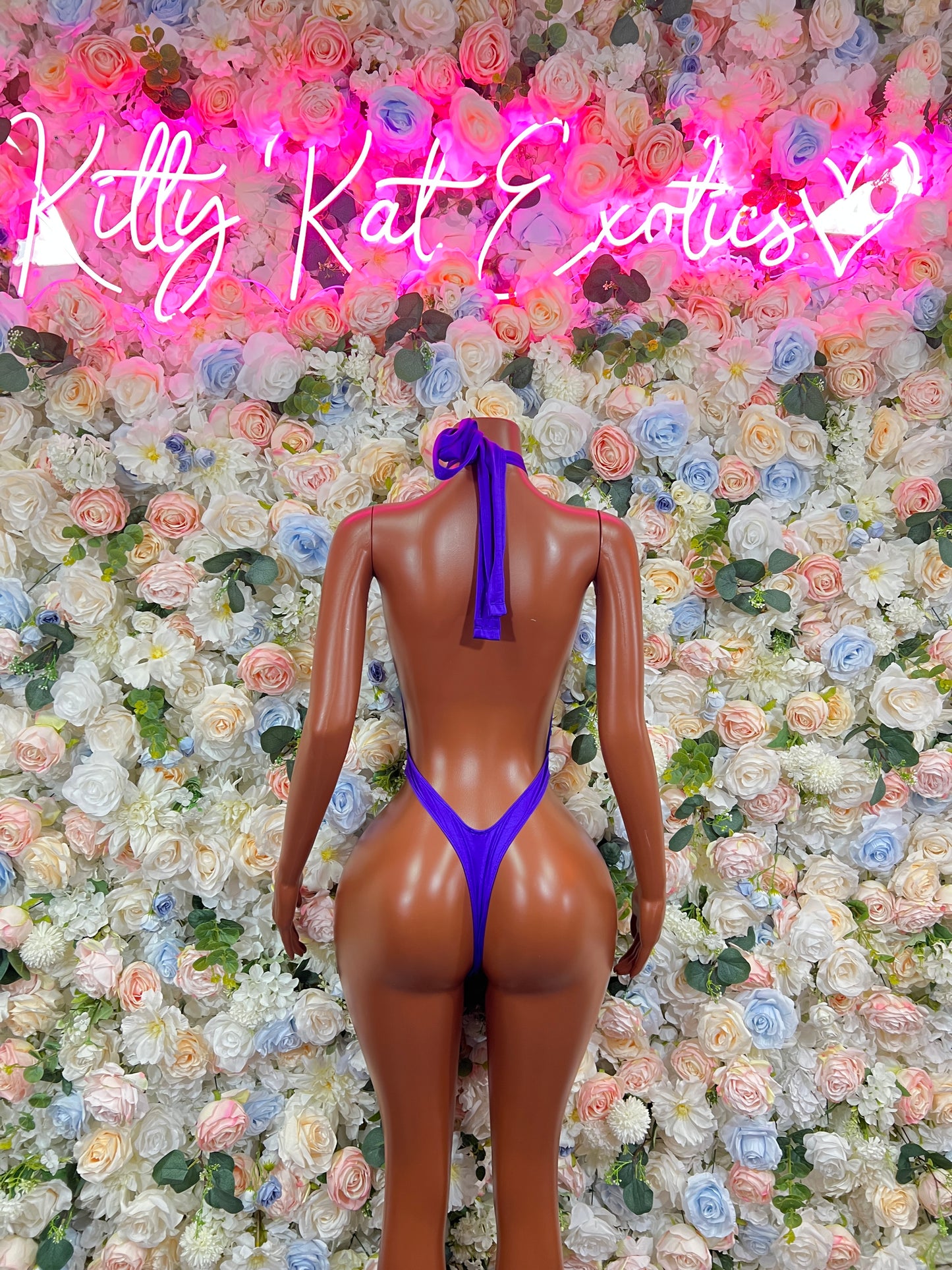 Purple backless one-piece bodysuit with halter straps and keyhole back
