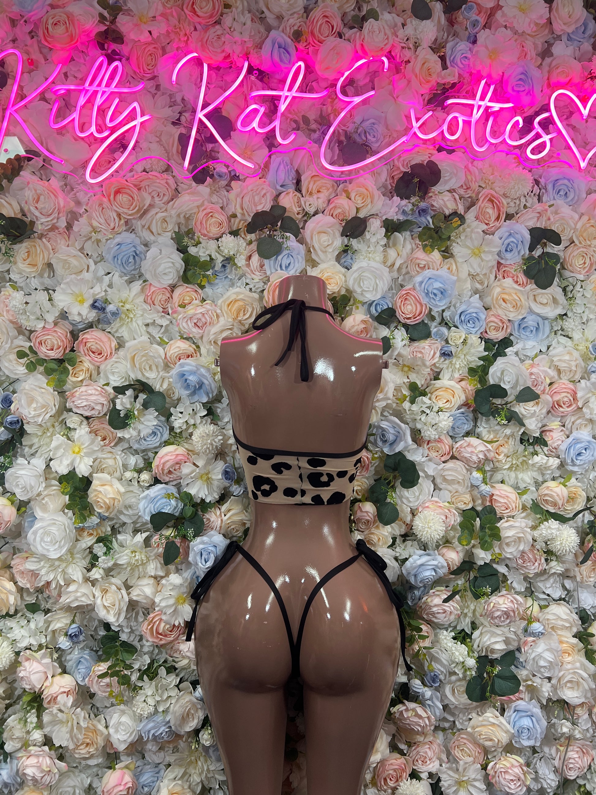 Leopard-print triangle bikini top with bow straps and matching string bottoms