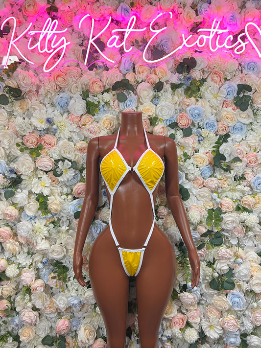 Yellow shiny latex bodysuit with white trim, strappy triangle bra and thong bottom