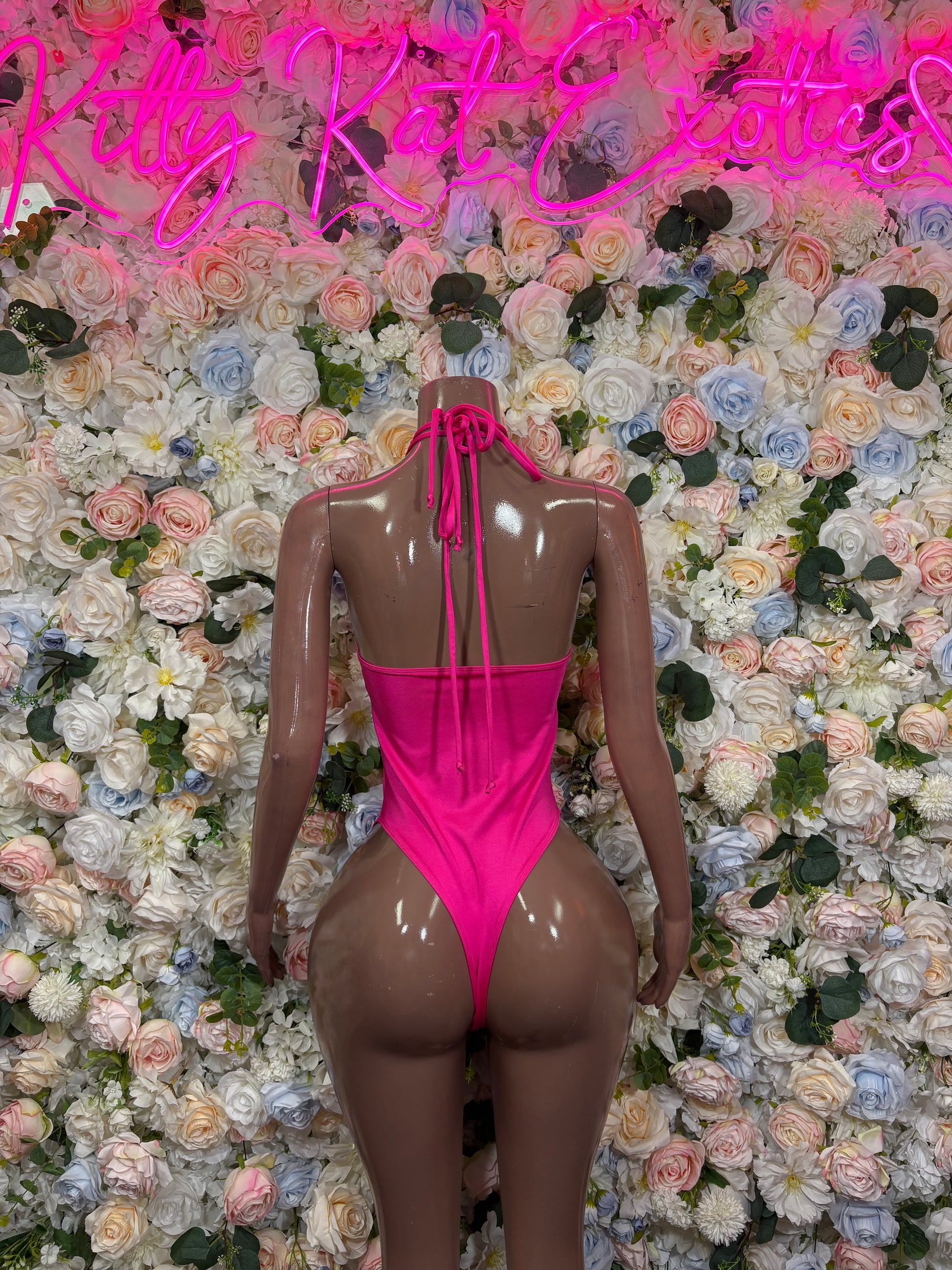 Pink lace-up backless bodysuit with tie-up halter straps