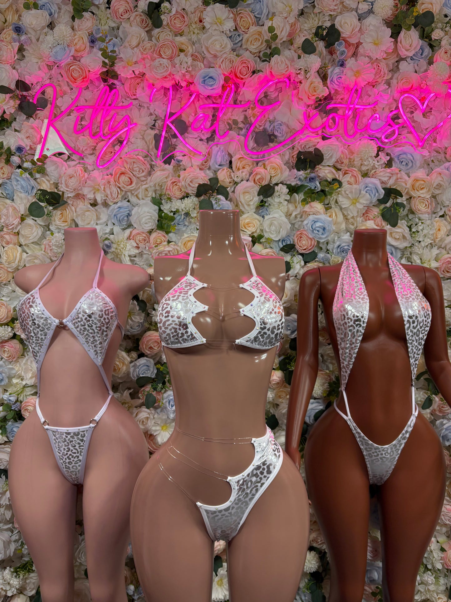 Set of three silver cheetah hologram bodysuits with plunging fronts and V-back