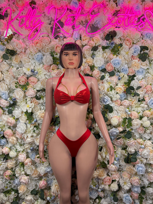 Red bikini top with center bow and matching thong bottoms on mannequin