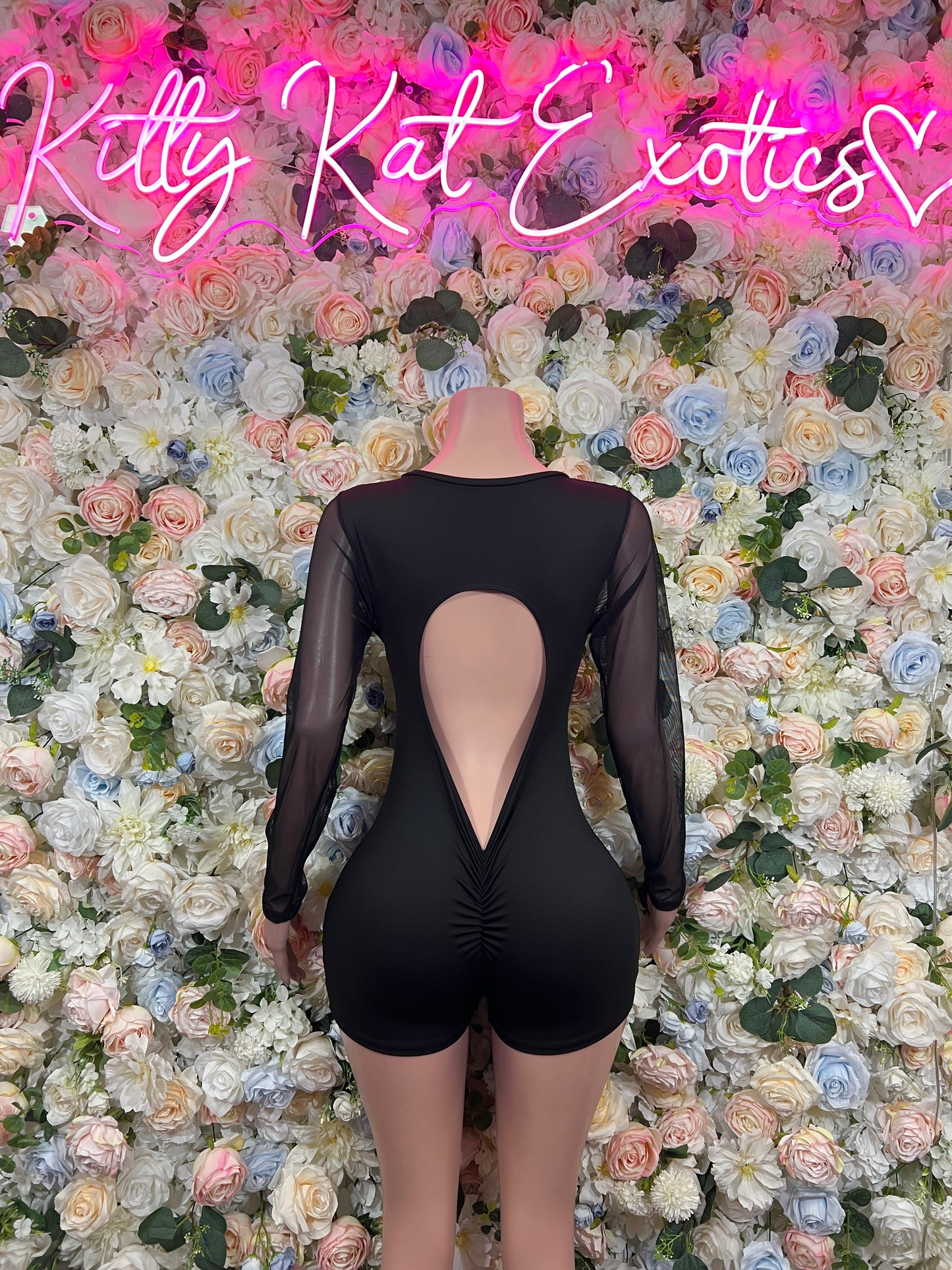 Black sheer long-sleeve bodysuit with open back oval cutout