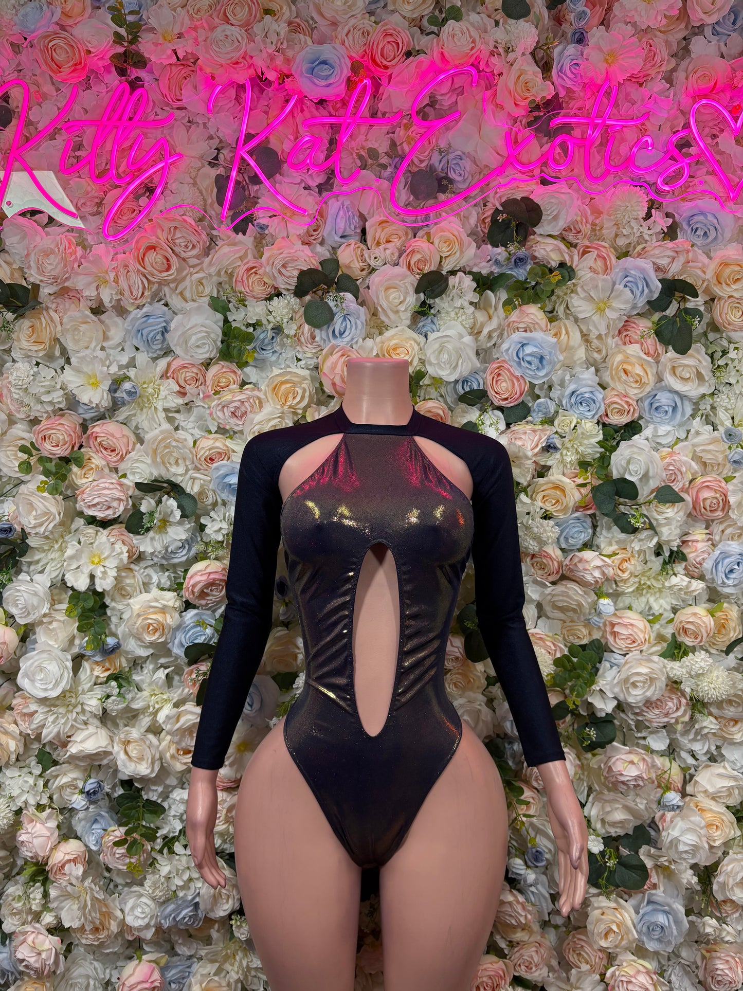 Navy long-sleeve bodysuit with chest cutout and metallic gold star front panel