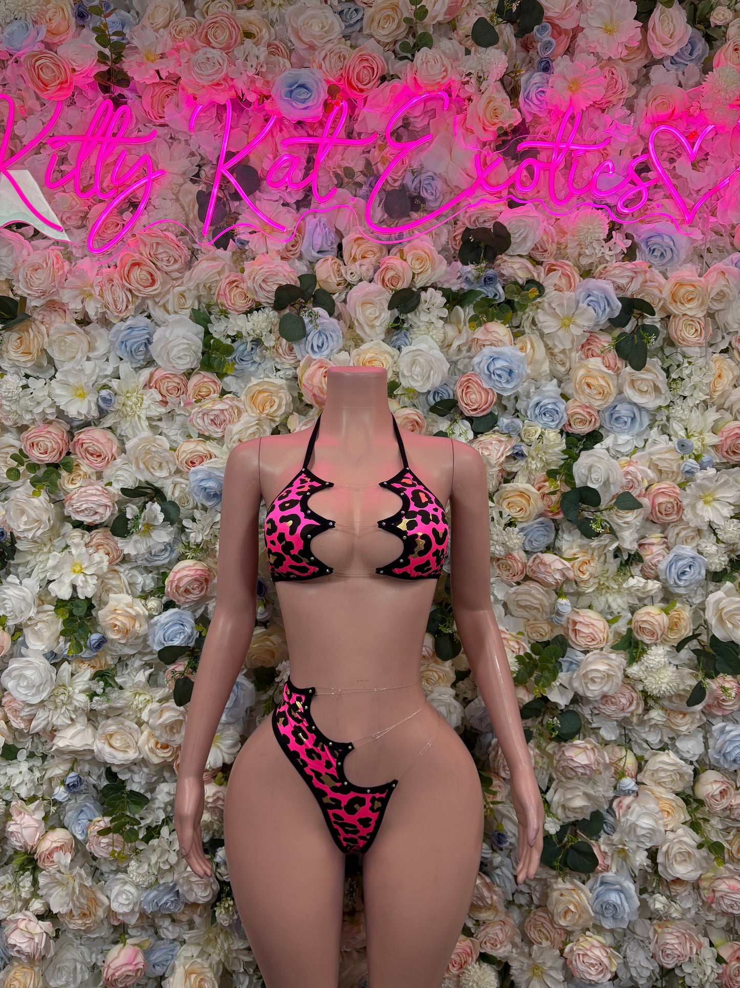 Hot pink cheetah-print bikini set with black trim, front view