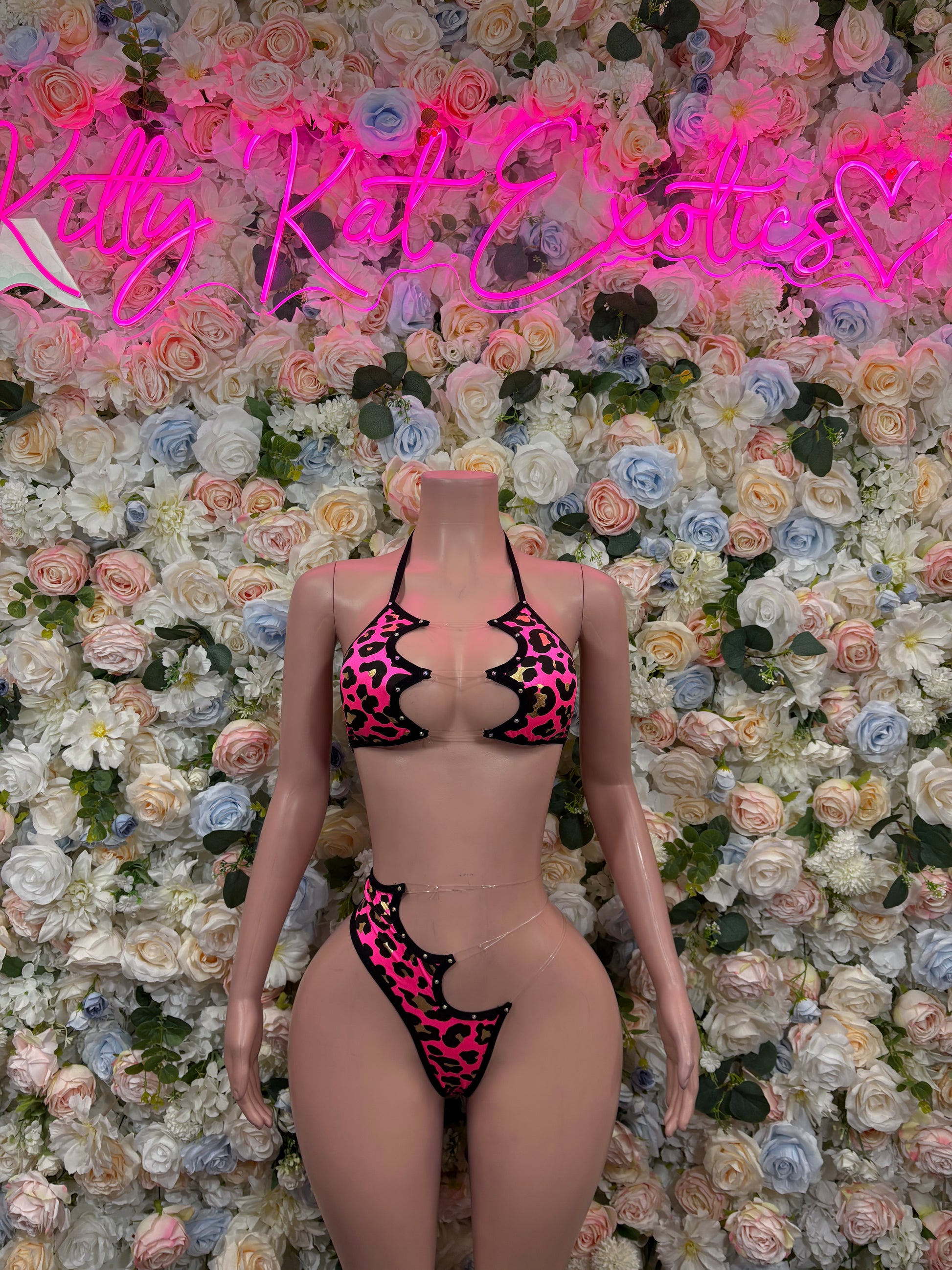 Hot pink cheetah-print bikini set with black trim, front view