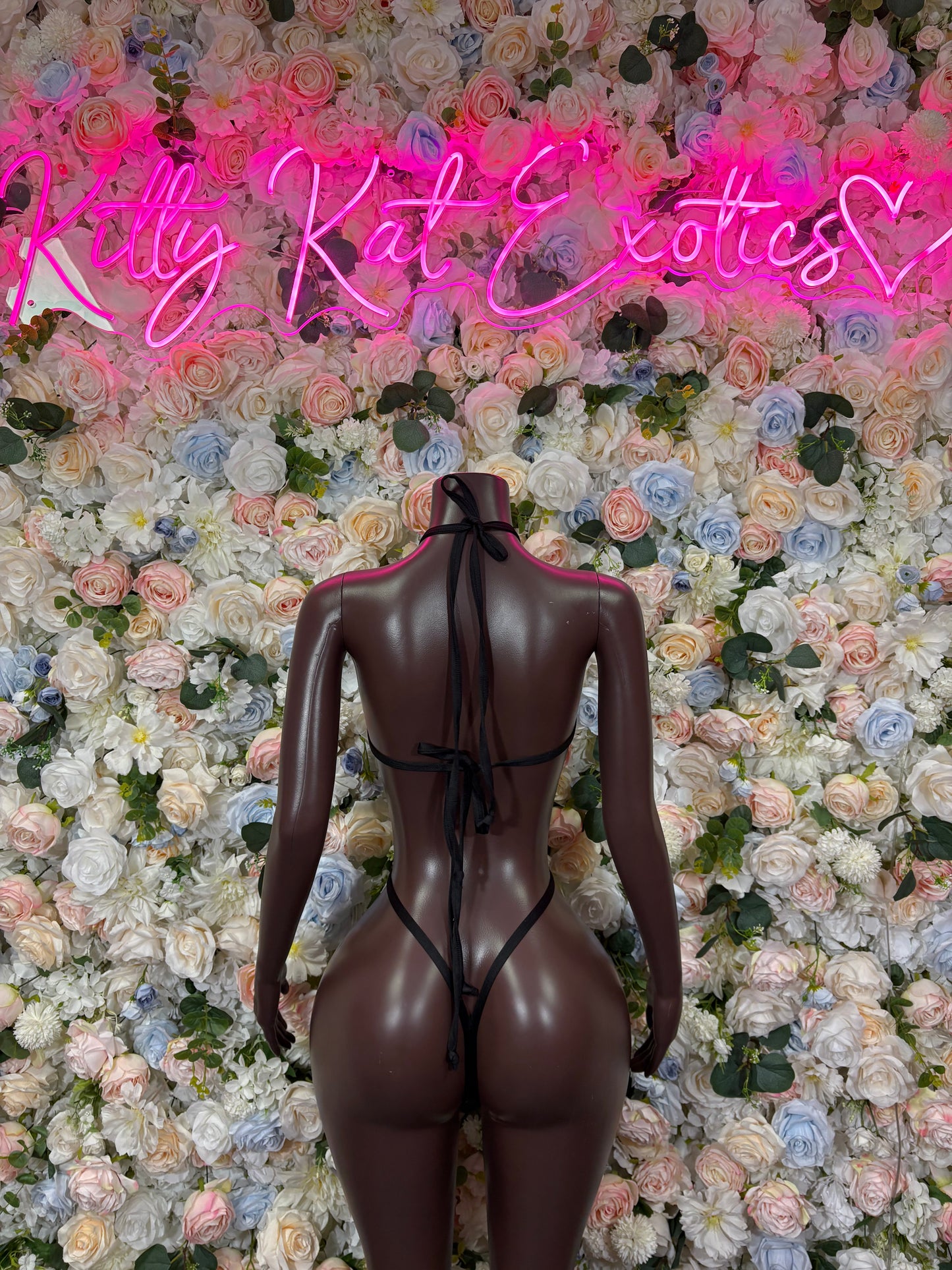 Tiger print bodysuit with black sheer back view, high-cut legs and halter straps