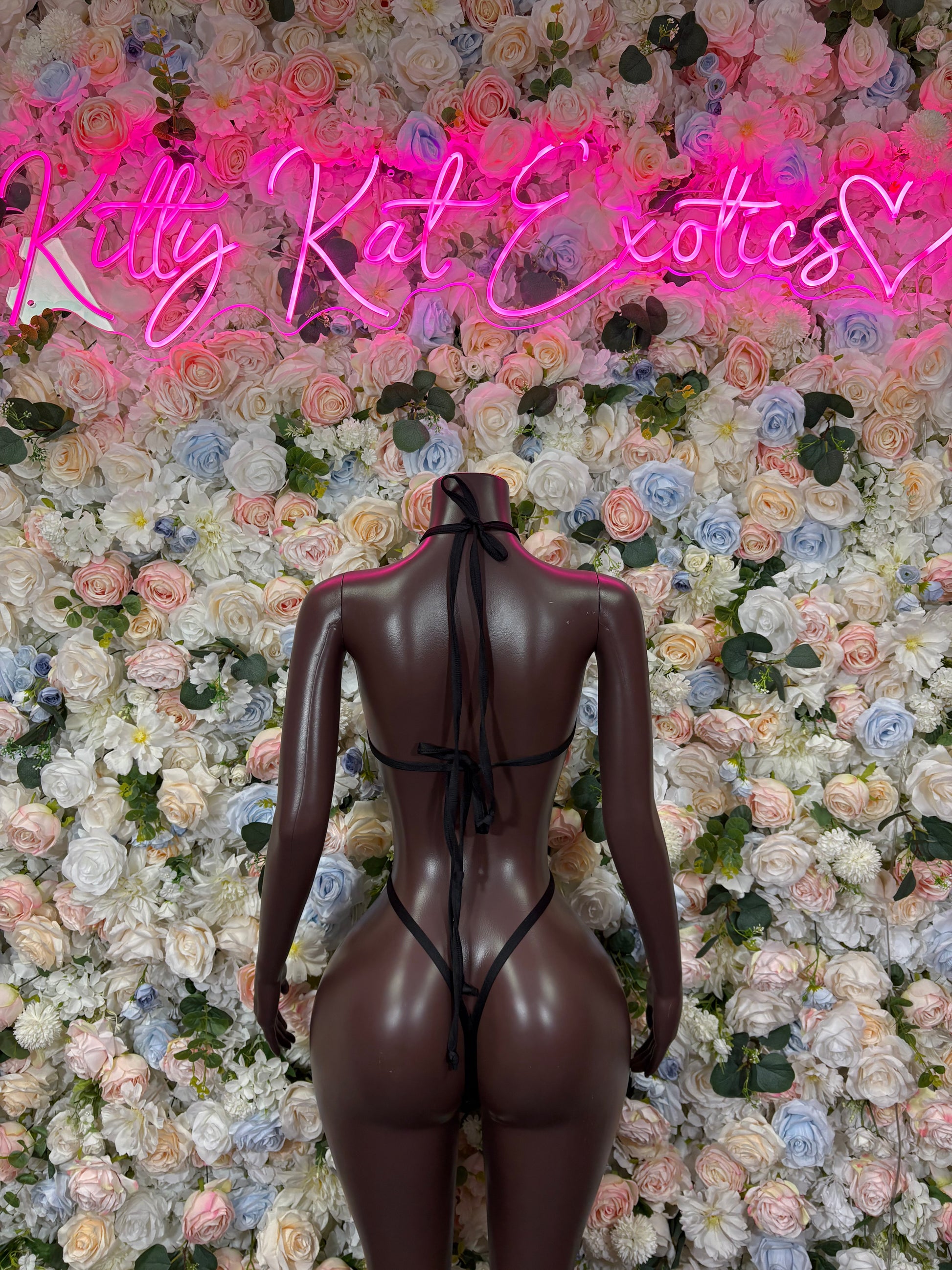 Tiger print bodysuit with black sheer back view, high-cut legs and halter straps