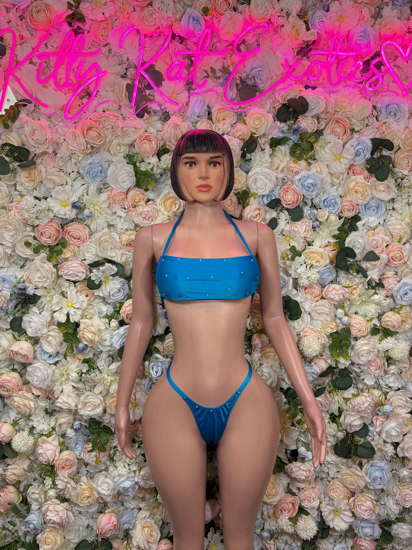 Blue two-piece rave outfit, front view: strappy triangle bra, matching string bikini bottoms