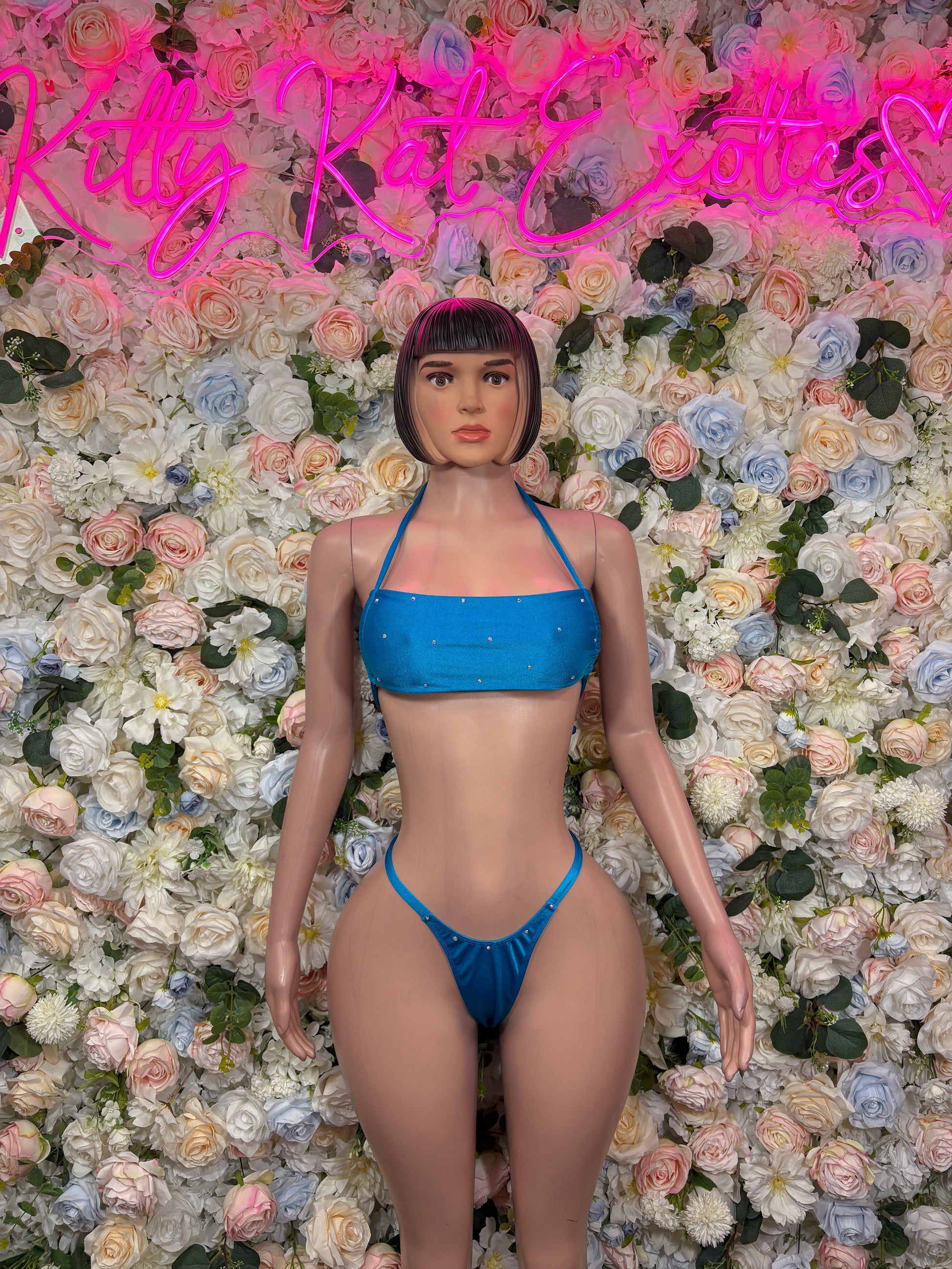 Blue two-piece rave outfit, front view: strappy triangle bra, matching string bikini bottoms