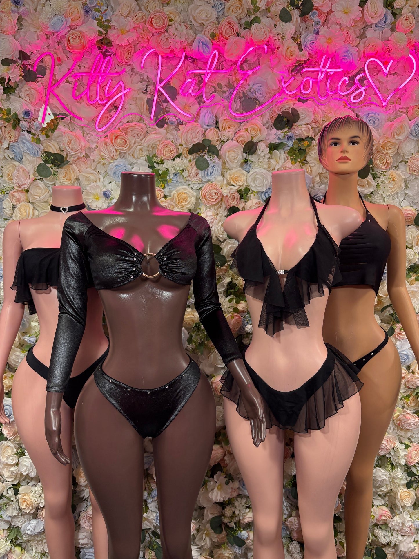 Two black ruffle crop top bikini sets with matching high-cut bottoms