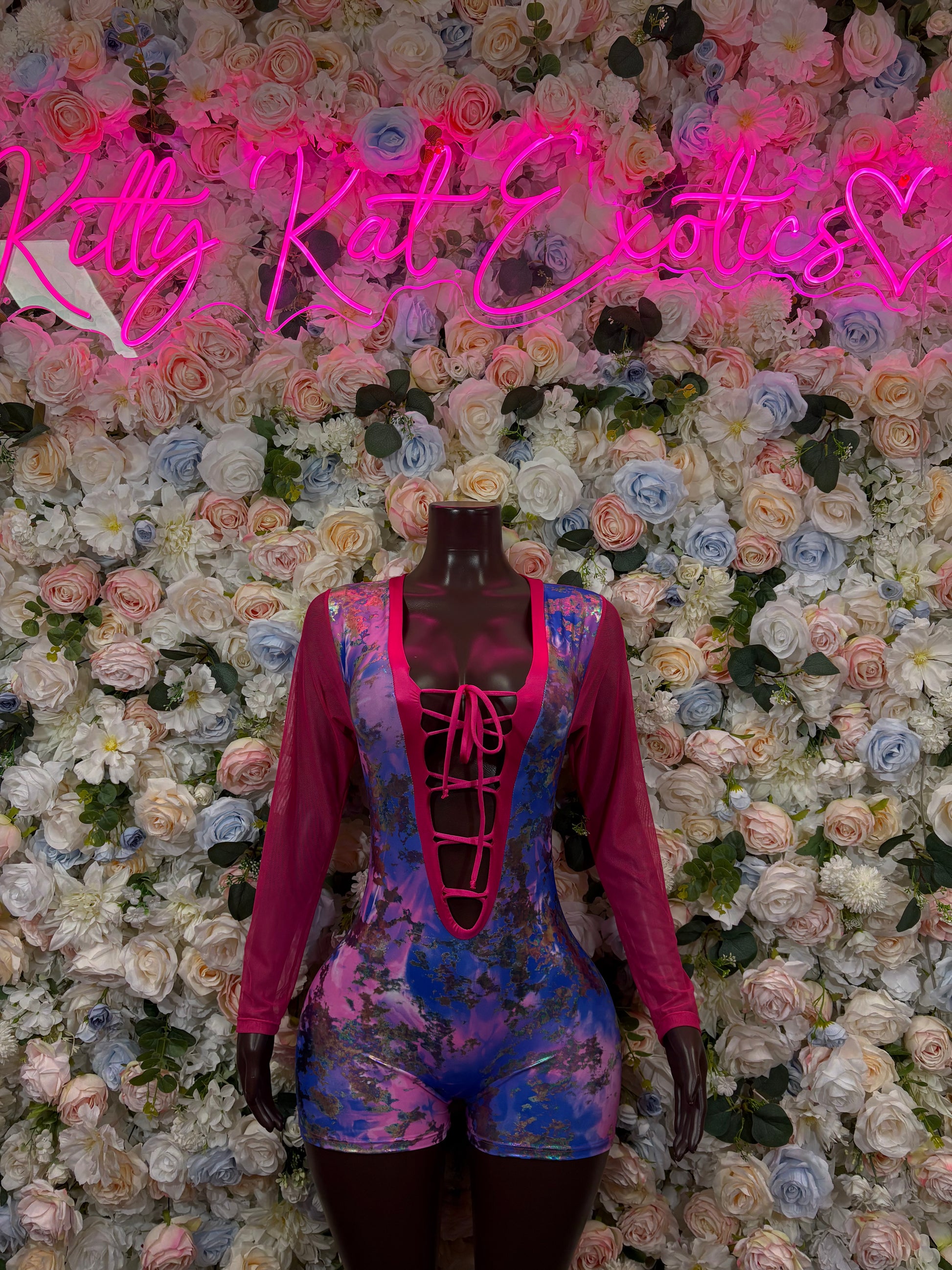 Pink and blue metallic bodysuit with long sleeves, lace-up front, deep neckline