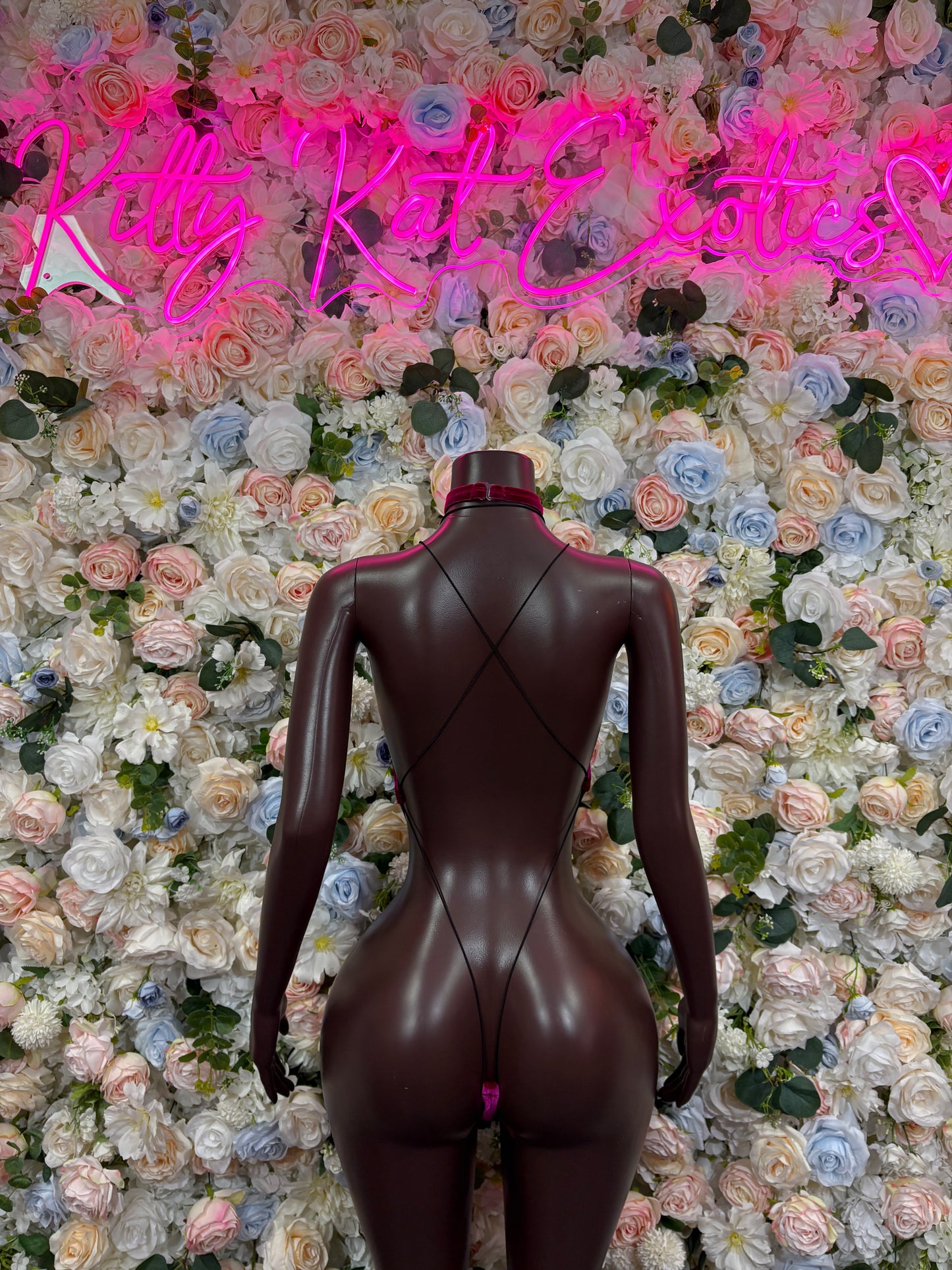 Purple halter one-piece bodysuit back view with V-shaped cutout
