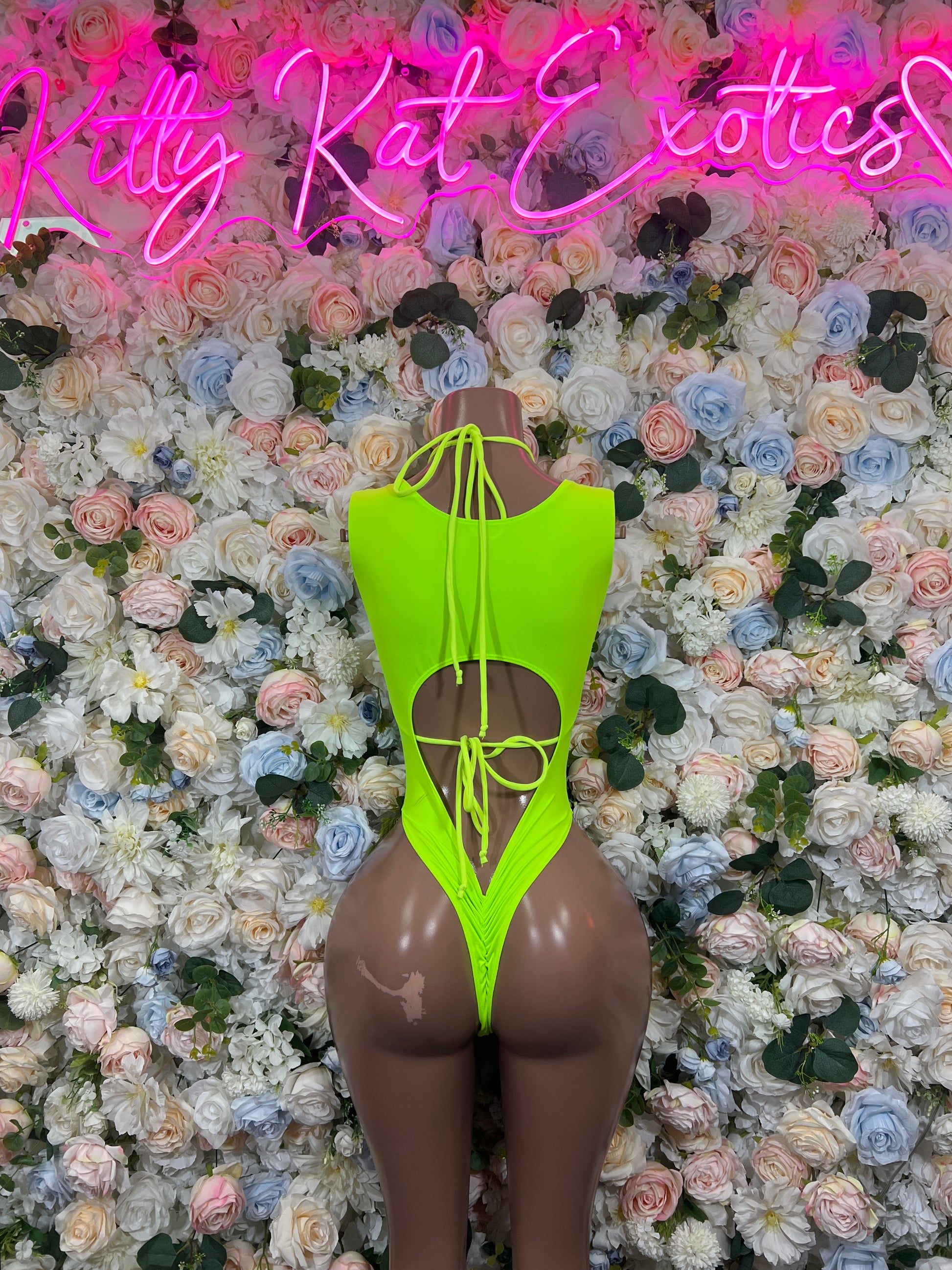 Neon green holographic bodysuit, deep V back with crisscross lace-up ties