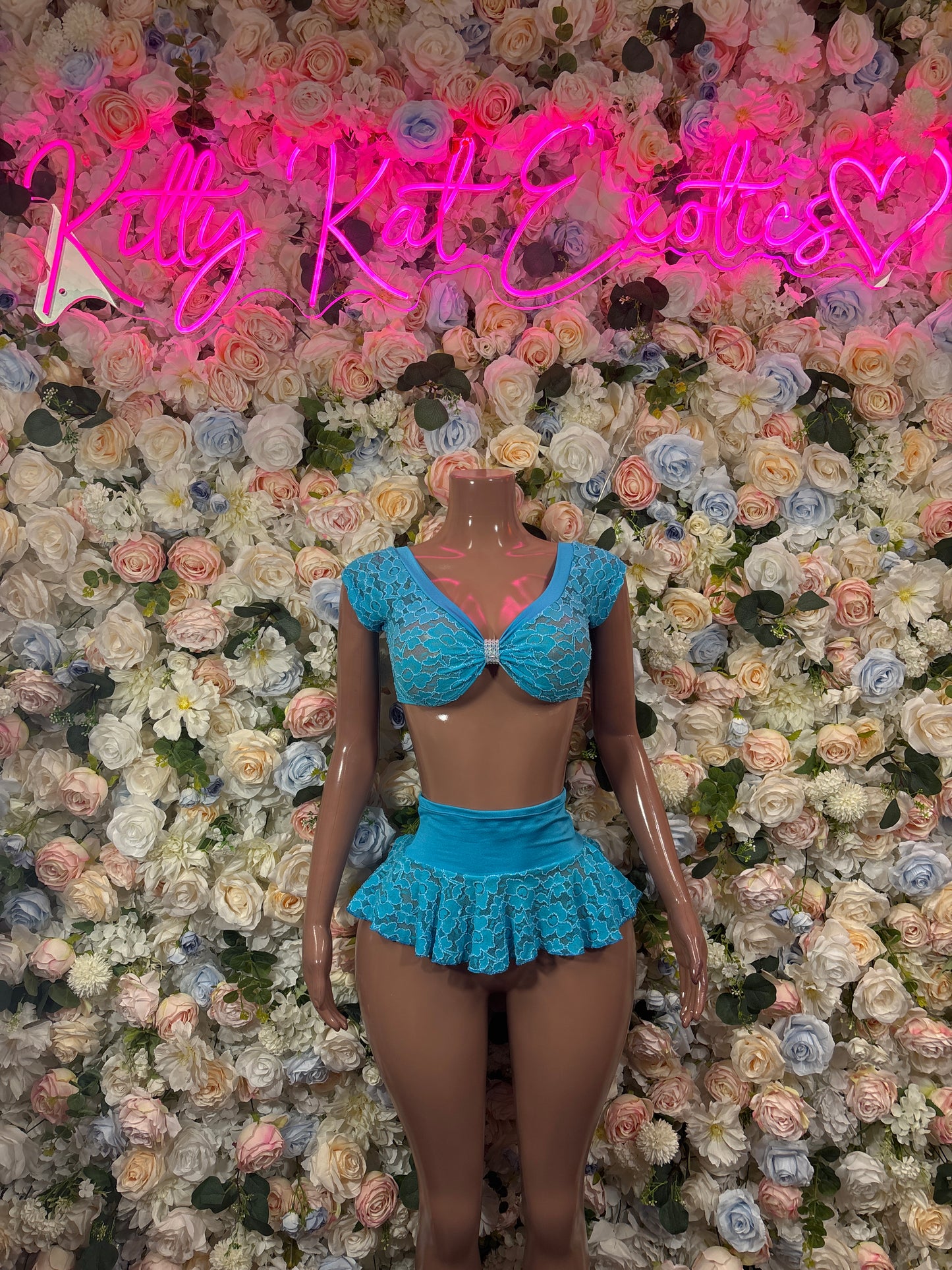 Blue lace mini skirt set with peplum top and matching mini skirt, front view
