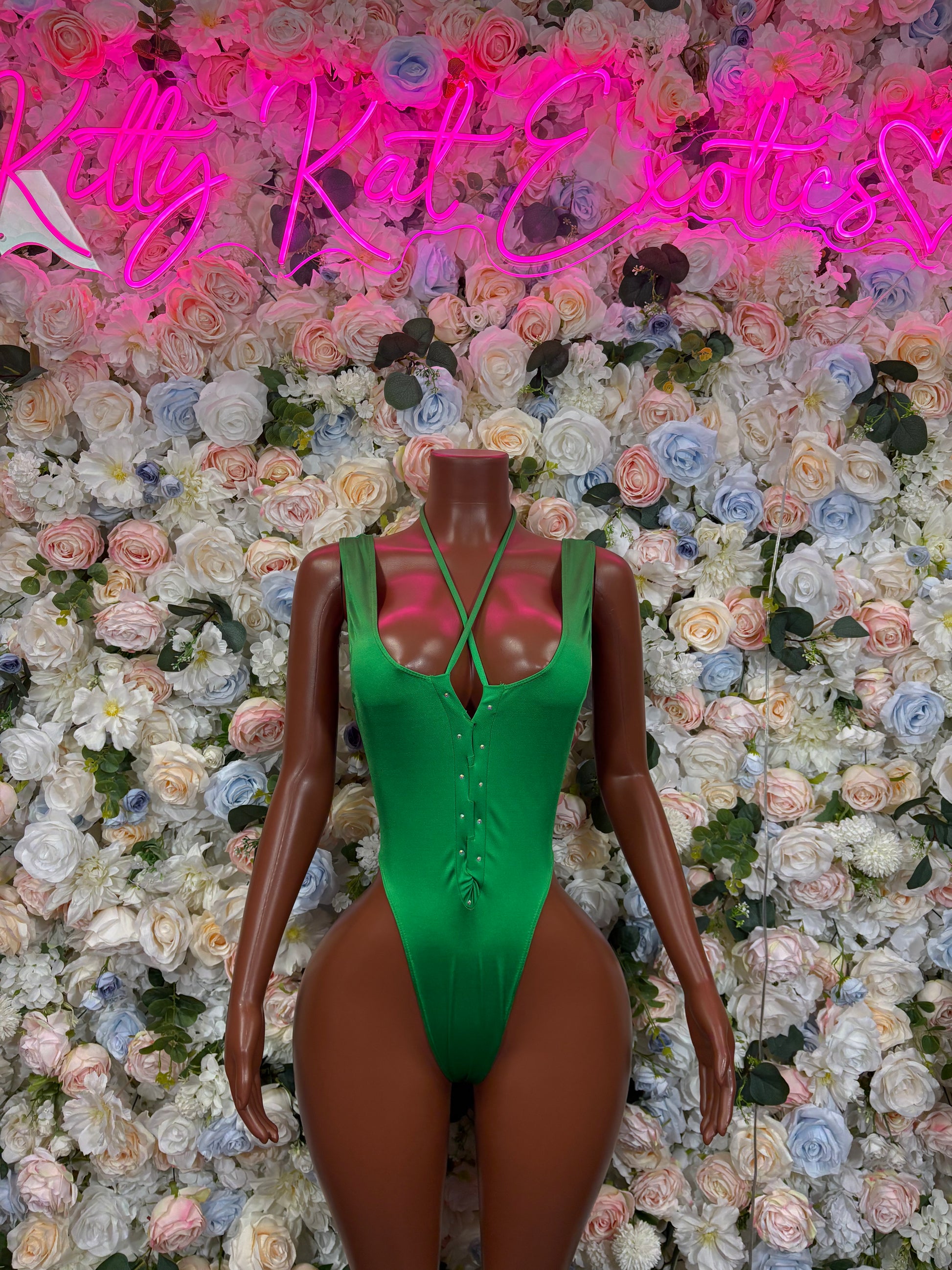 Green strappy bodysuit with V-neck and thong-style bottom