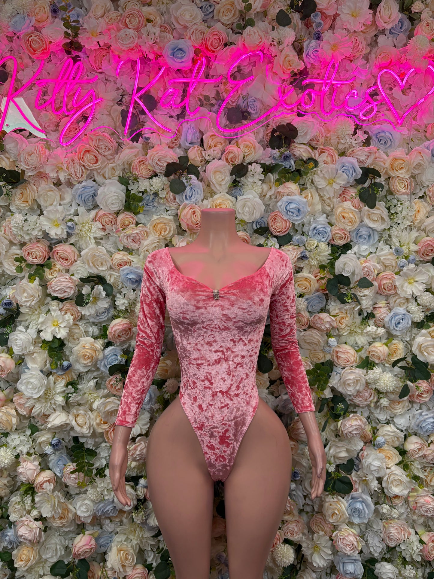 Pink velvet long-sleeve bodysuit with square neckline and high-cut thong bottom