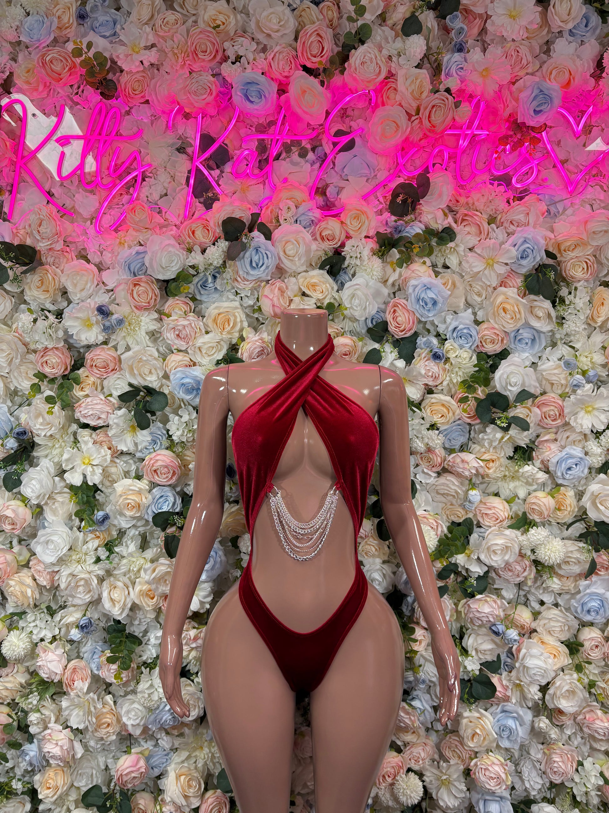 Red velvet halter one-piece bodysuit with draped front and chain fringe detail