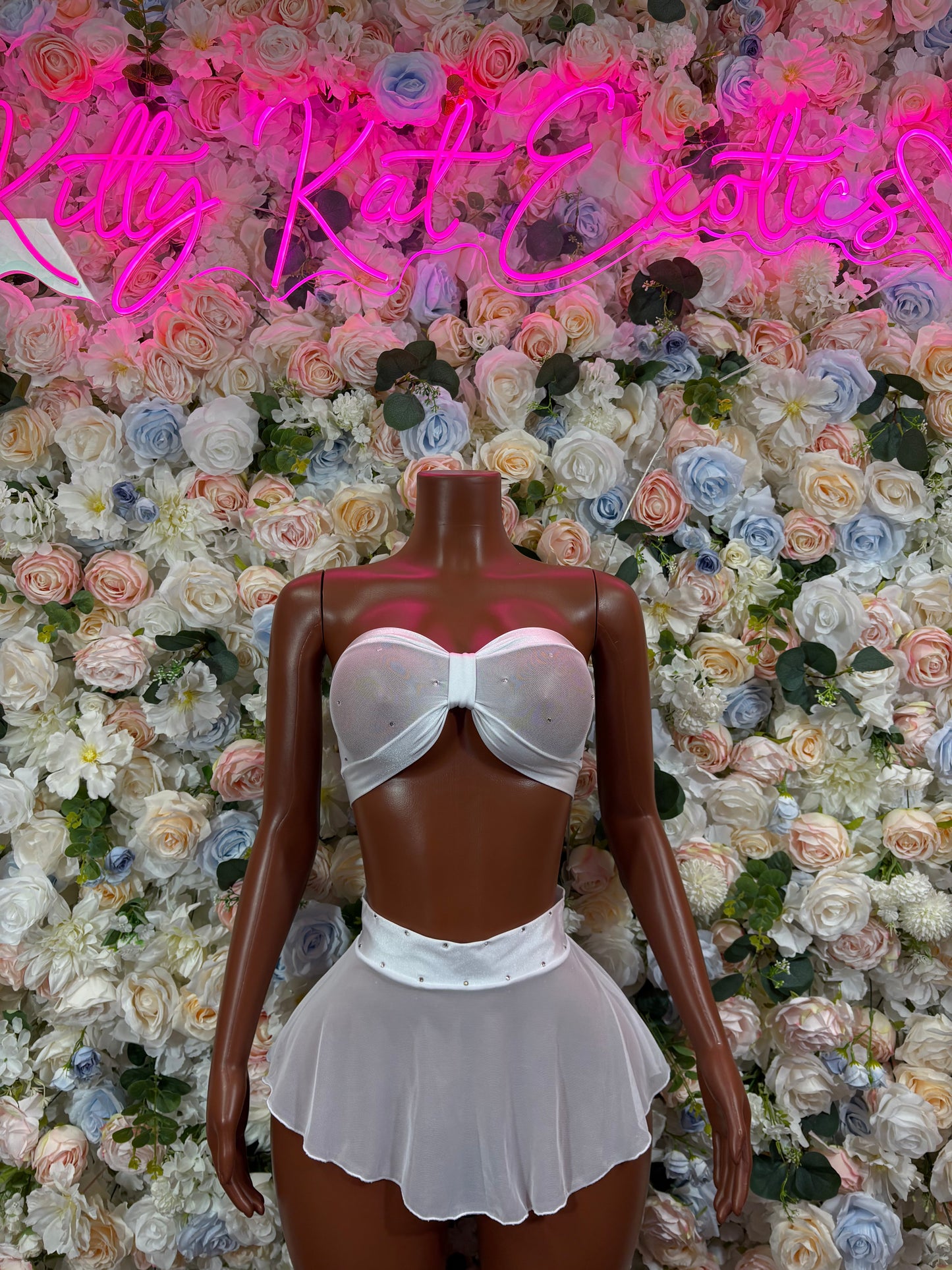 White strapless bra and pleated mini skirt two-piece set, front view