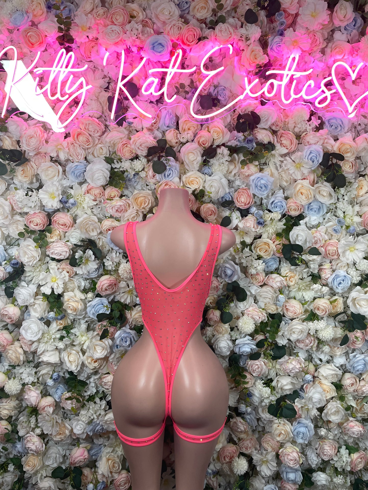 Coral rhinestone bodysuit with V-back and strappy leg straps