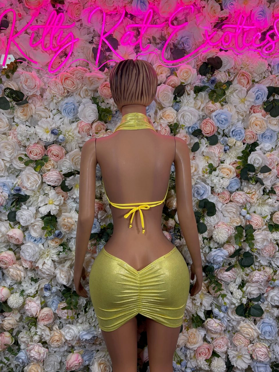 Metallic lime yellow halter crop top and mini skirt two-piece set, back view