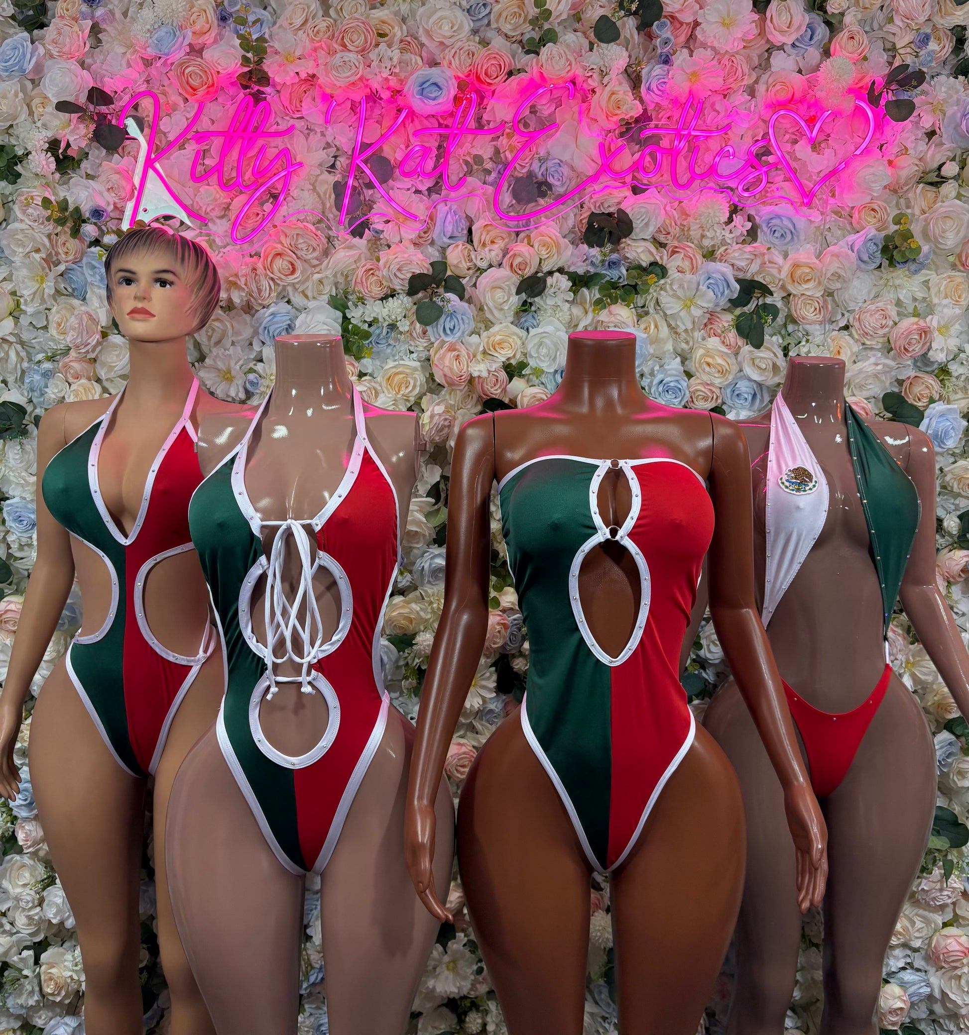 Women’s Mexican flag bodysuit on mannequins, red/green/white one-piece with lace-up