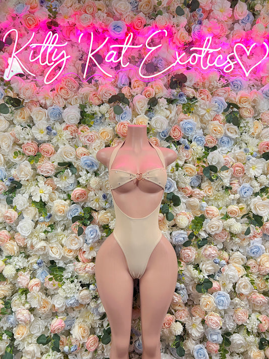 Nude one-piece dancewear set with cutout high-leg bottoms